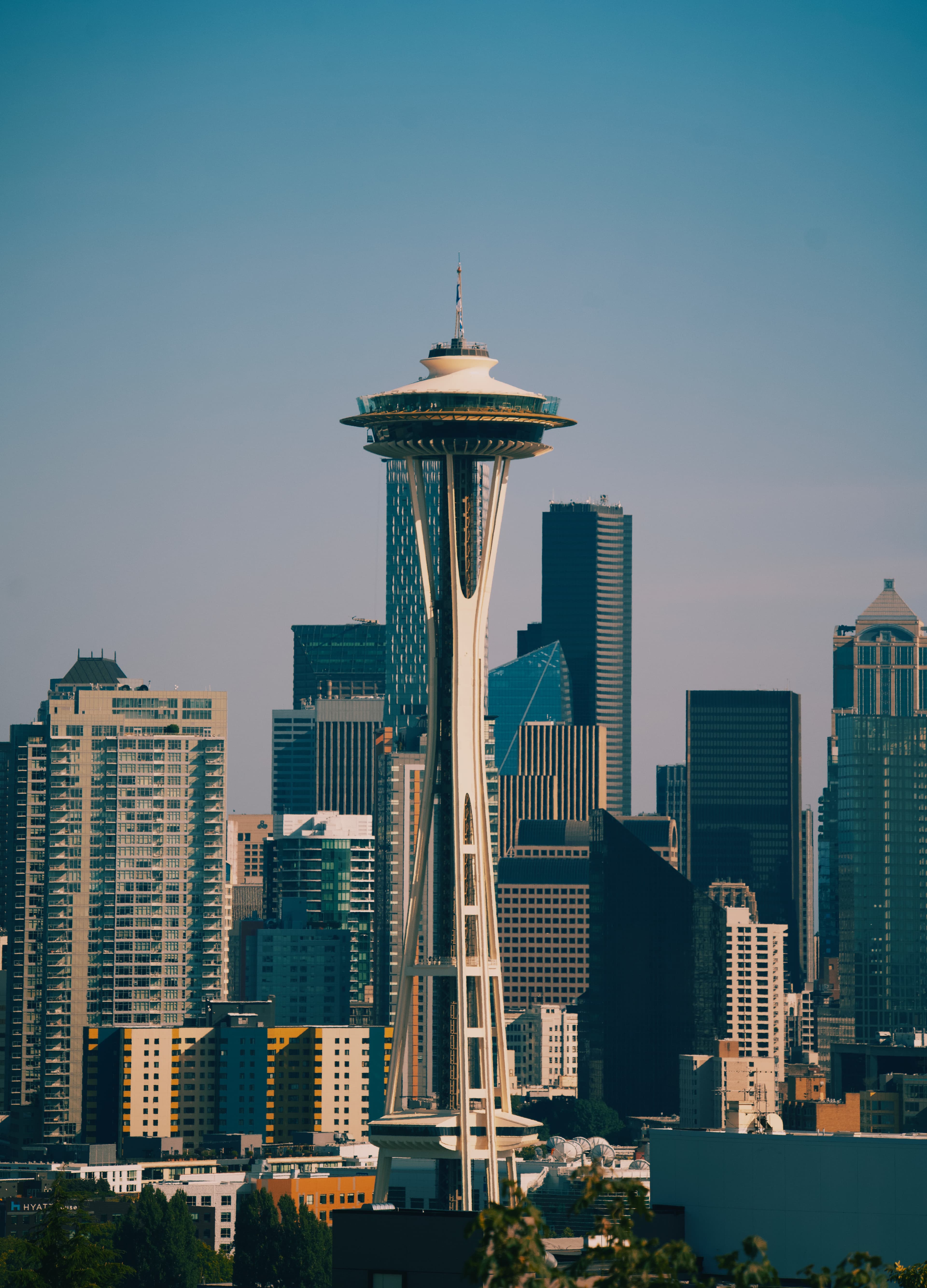 View of buildings in city with clear skies during daytime