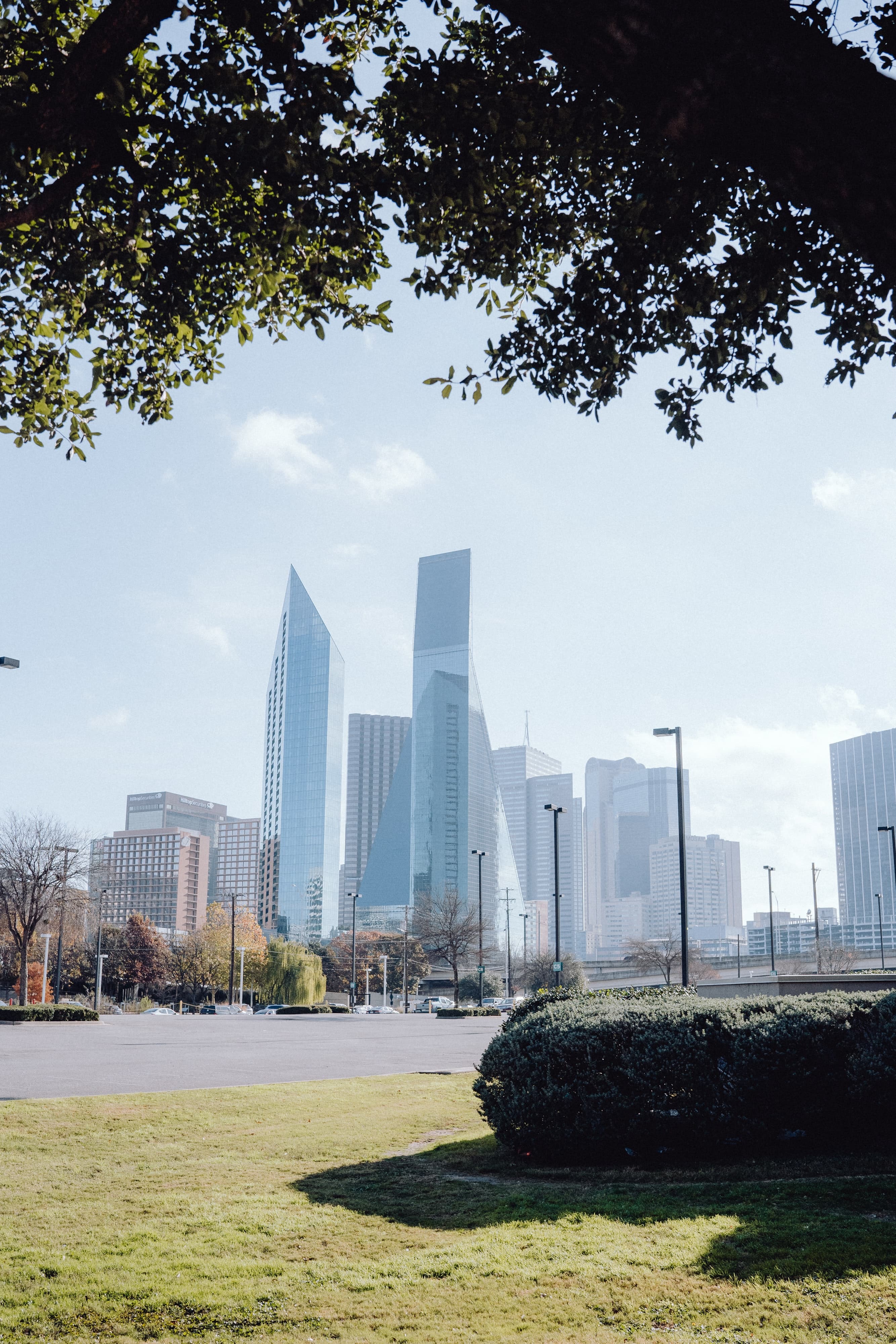 Grass field with buildings during daytime