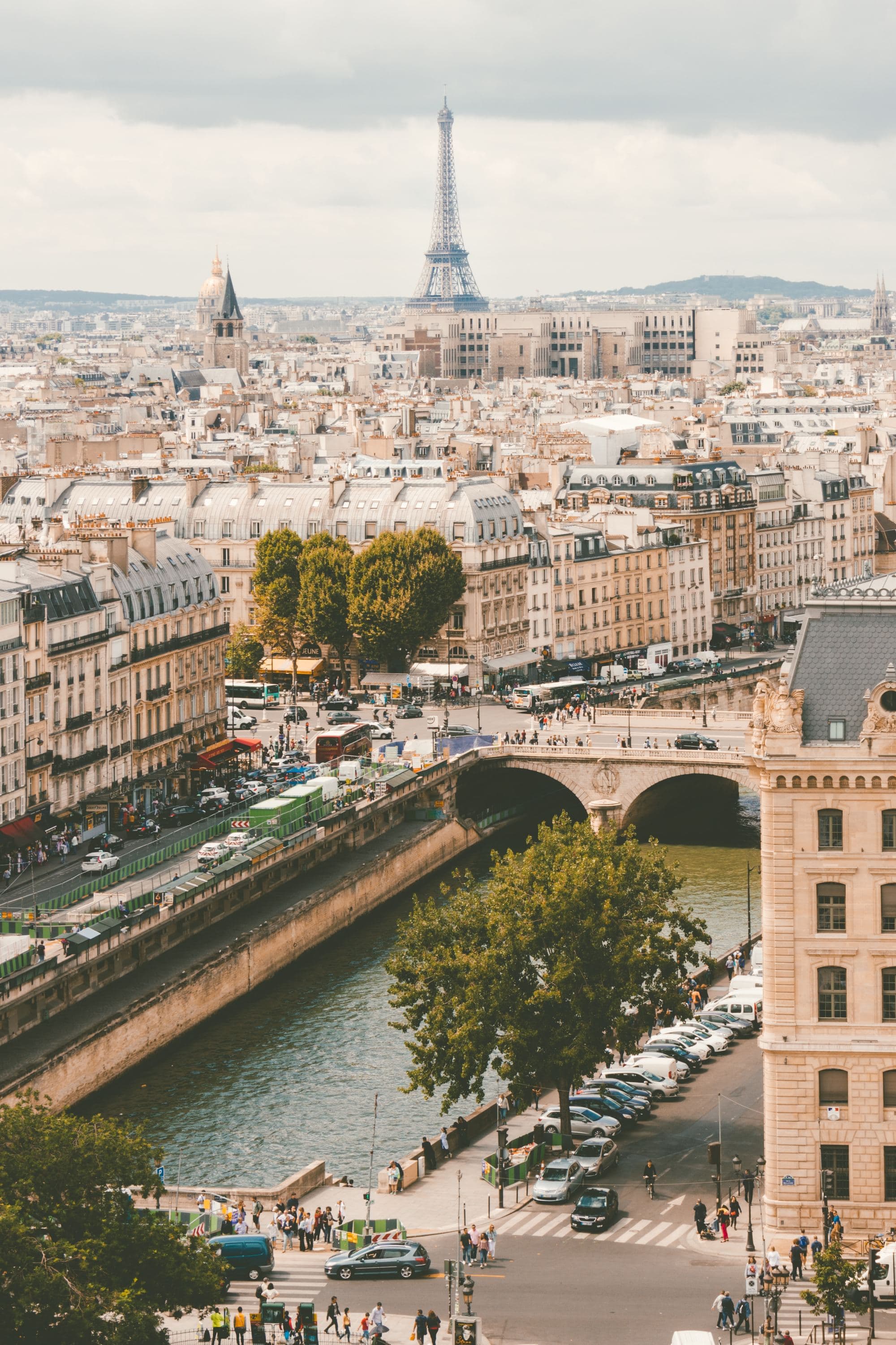 Aerial view of Paris with city canal and buildings during daytime.