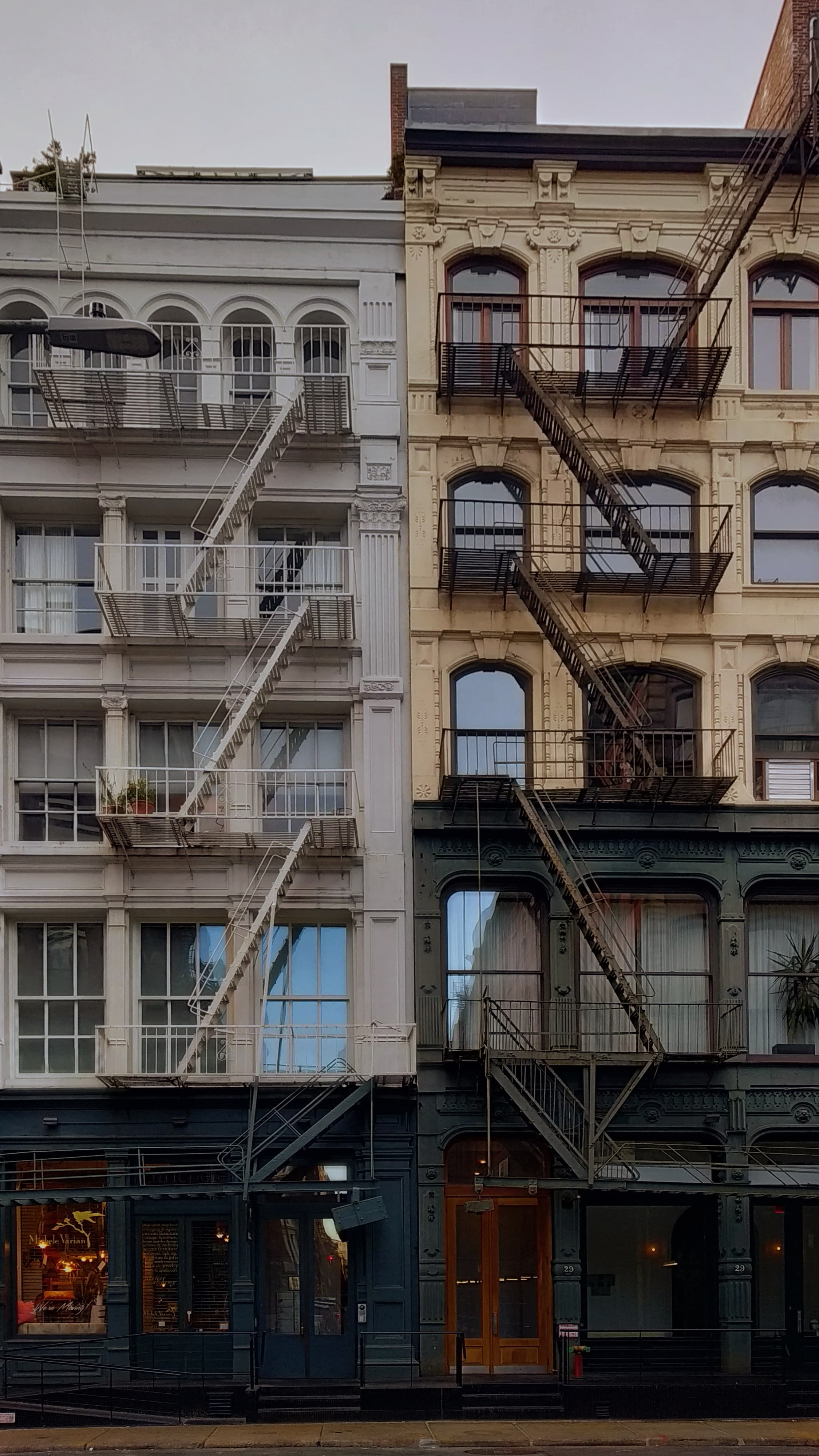 Two, white and black, buildings in New York City.