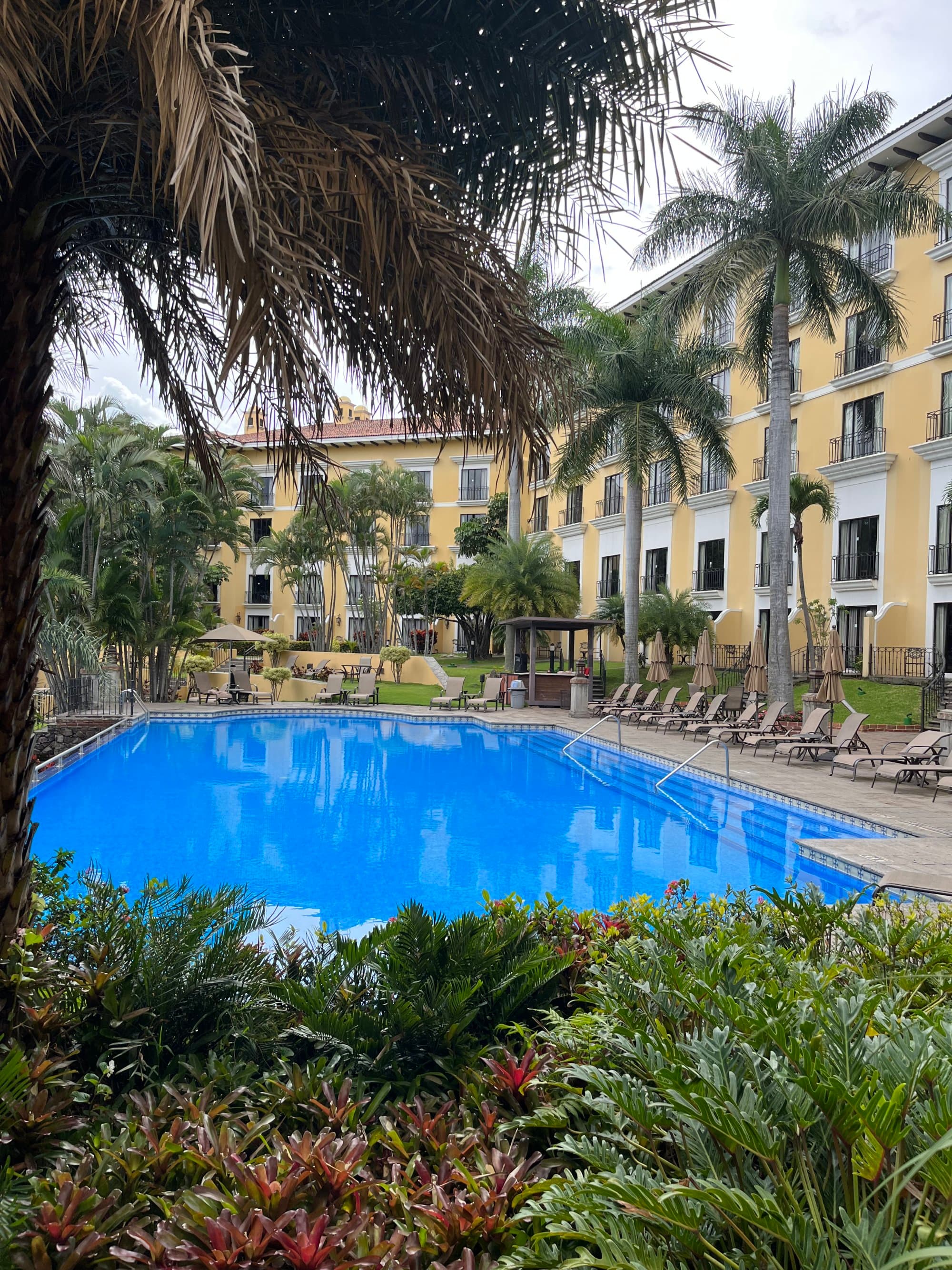 A resort with swimming pool in the middle.