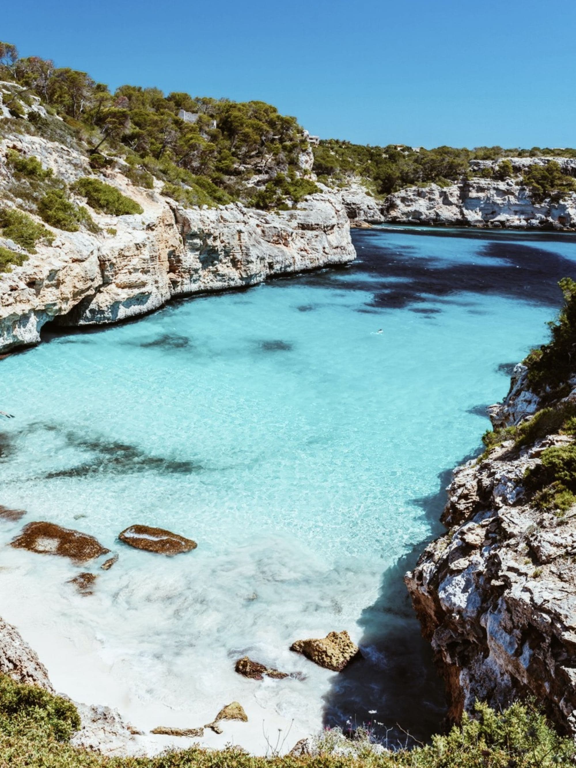 An aerial view of the beach between the cliffs.