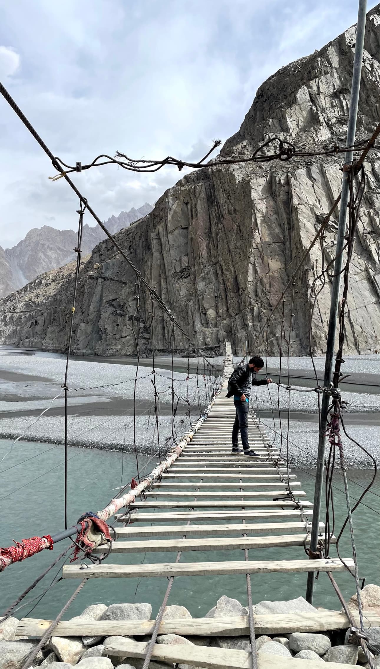 A guy on a rope bridge in Pakistan.