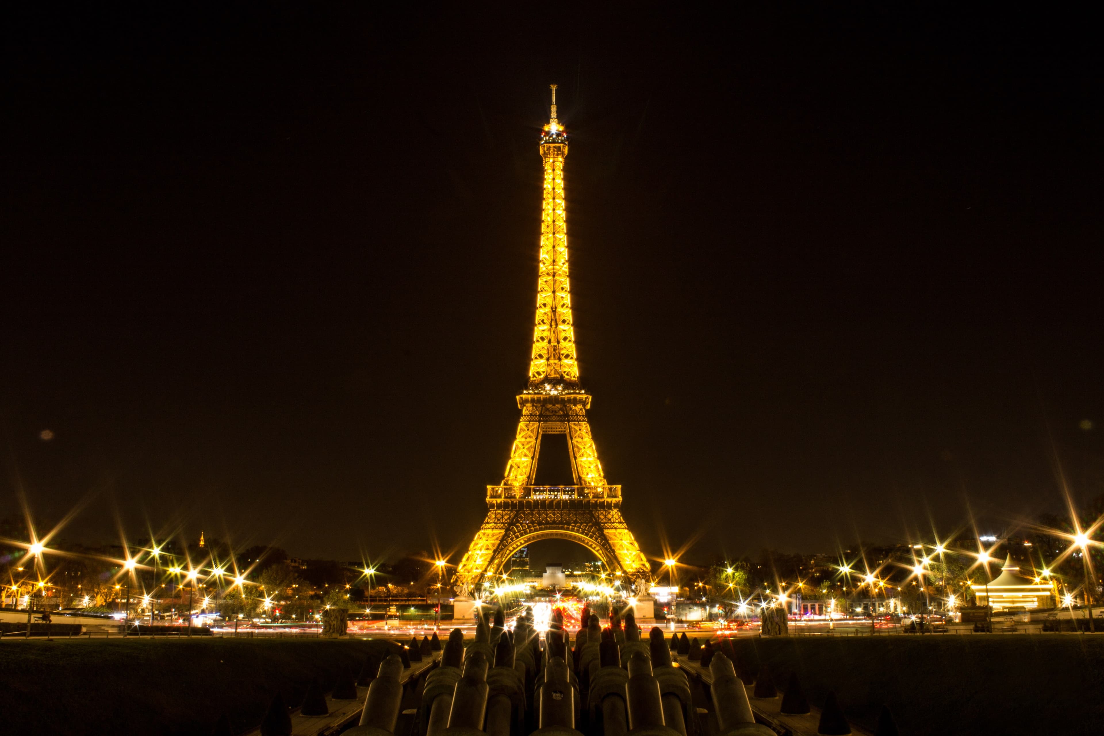 An aerial view of the Eiffel tower during nighttime.