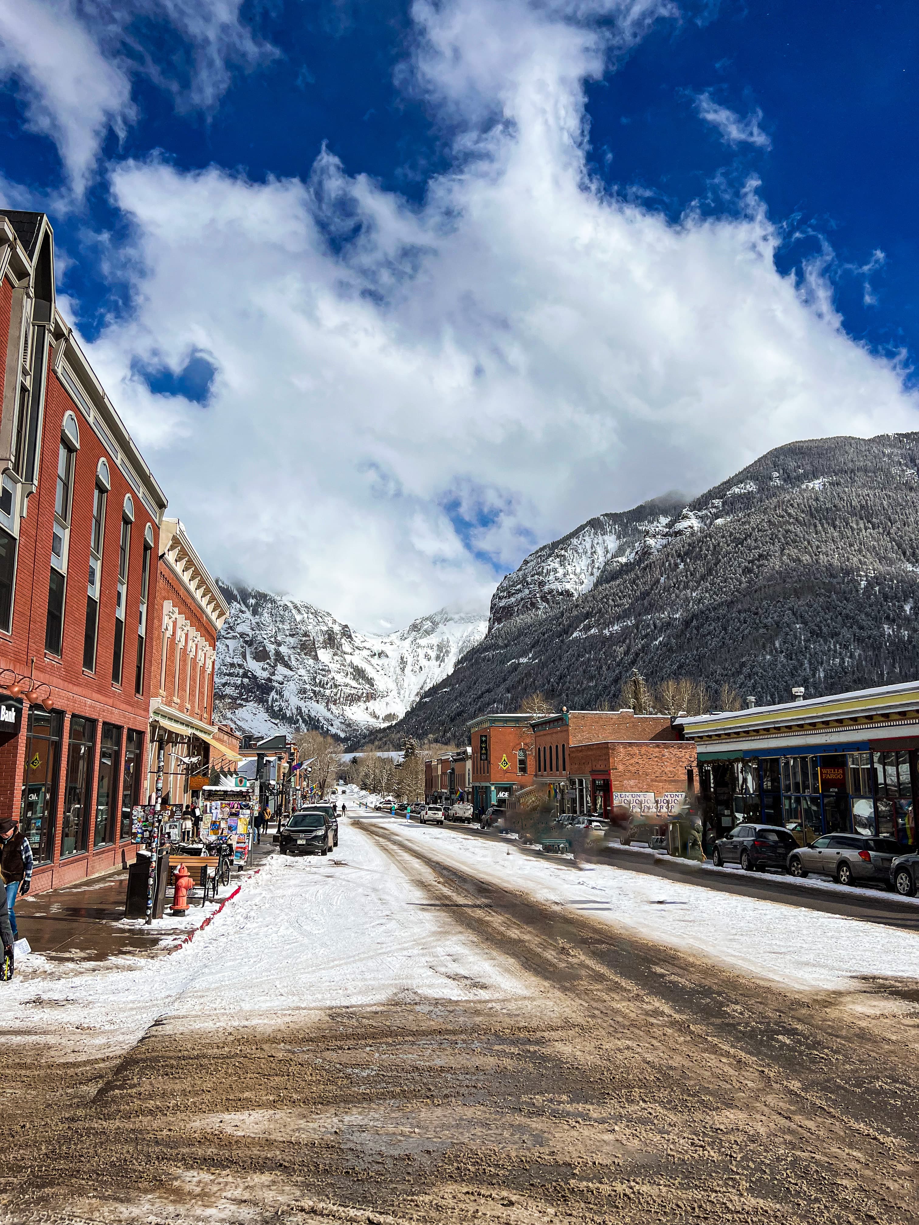 Snow capped mountains with white clouds
