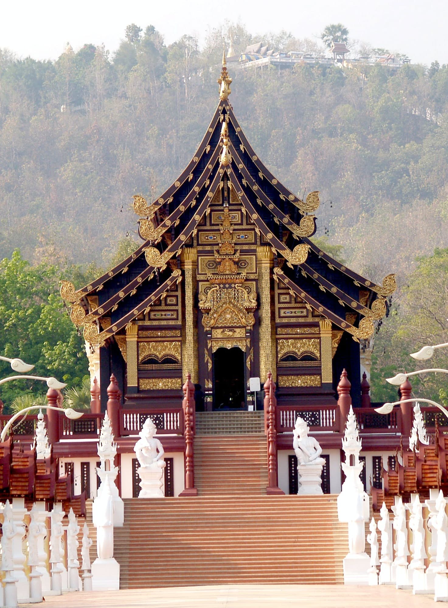View of a large and intricate black and gold building