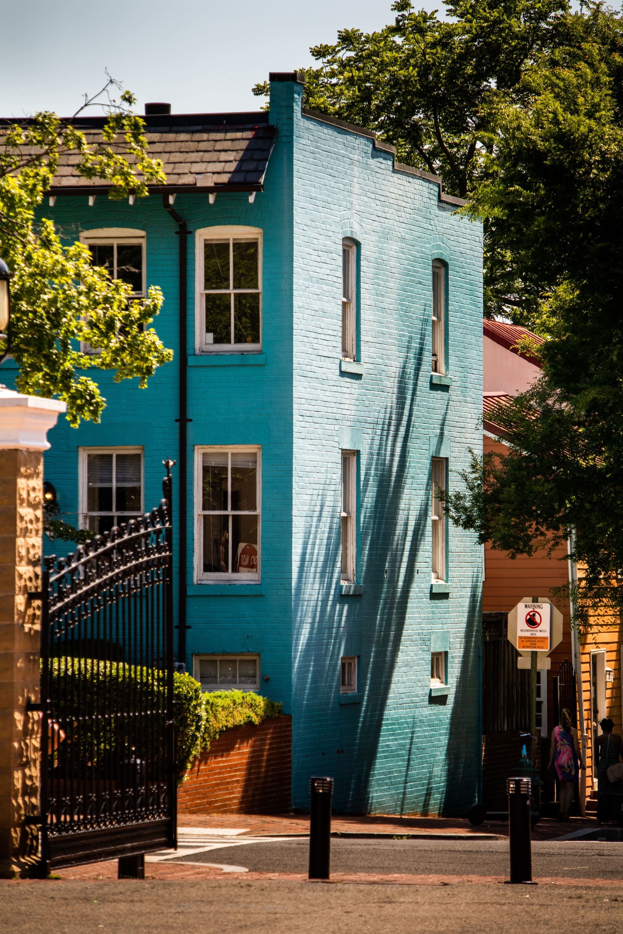 blue house on a cobblestone street