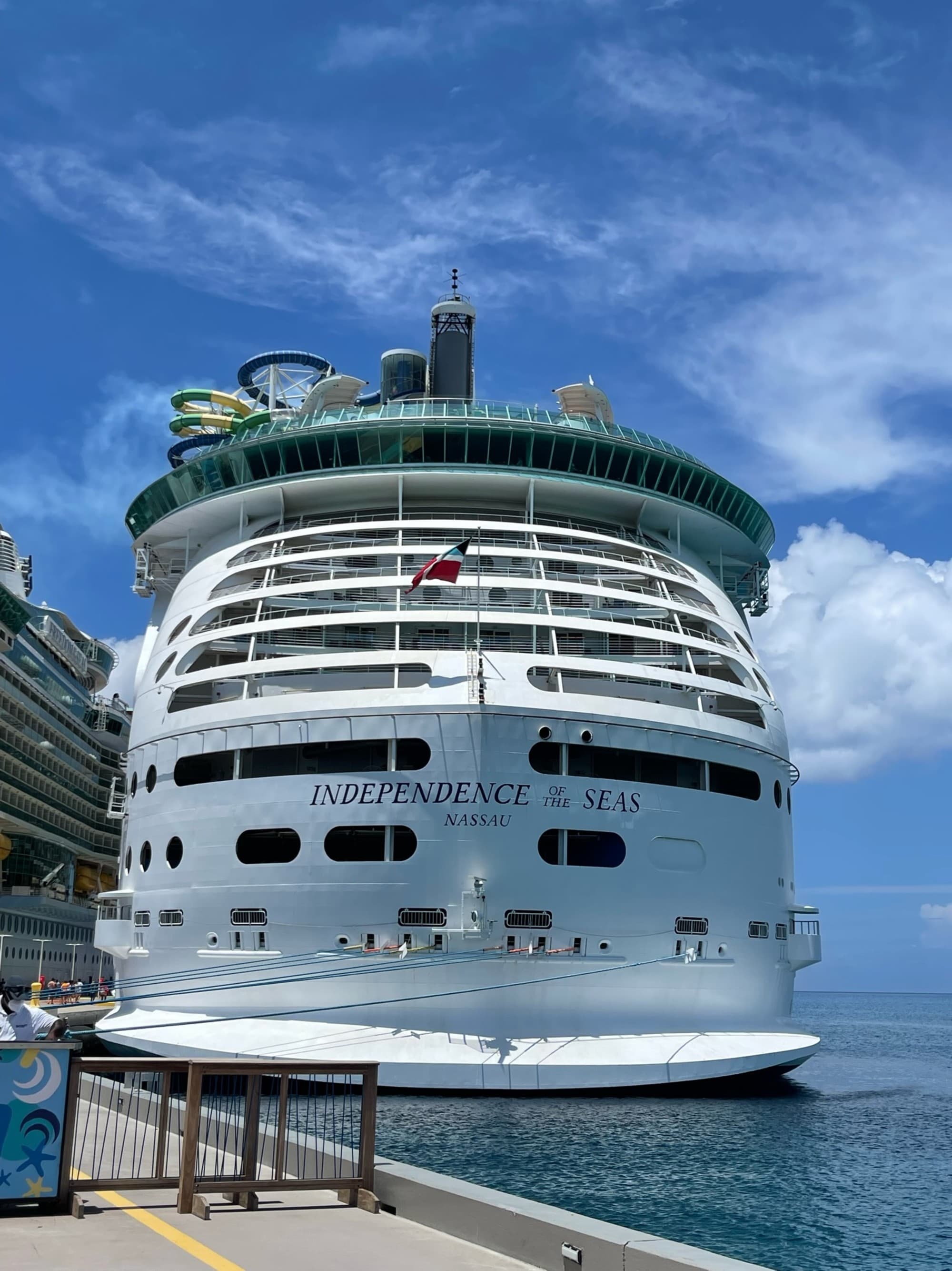 A picture taken from the front of a cruise ship during the daytime.