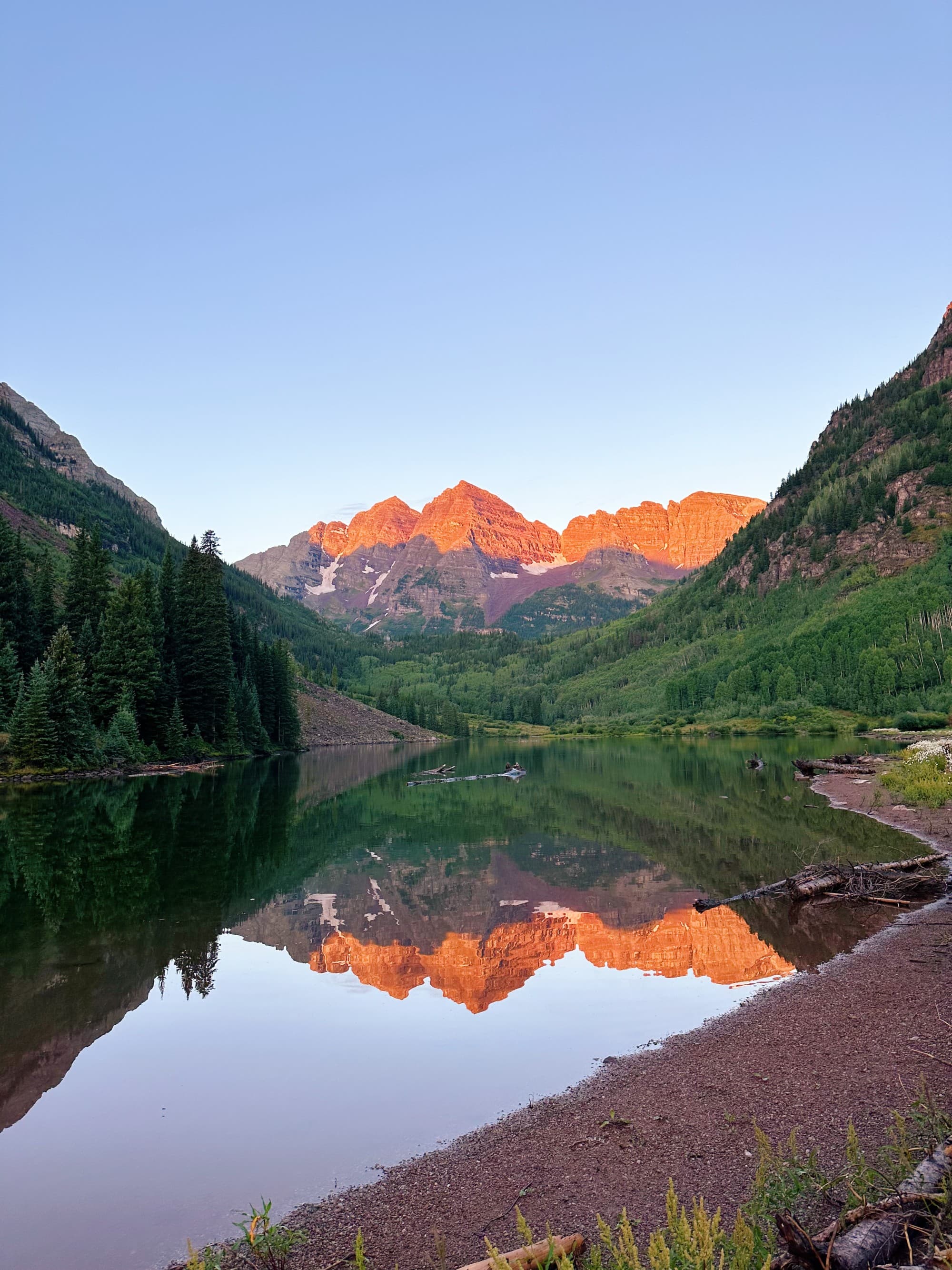 An aerial view of the sea with mountains during daytime hours