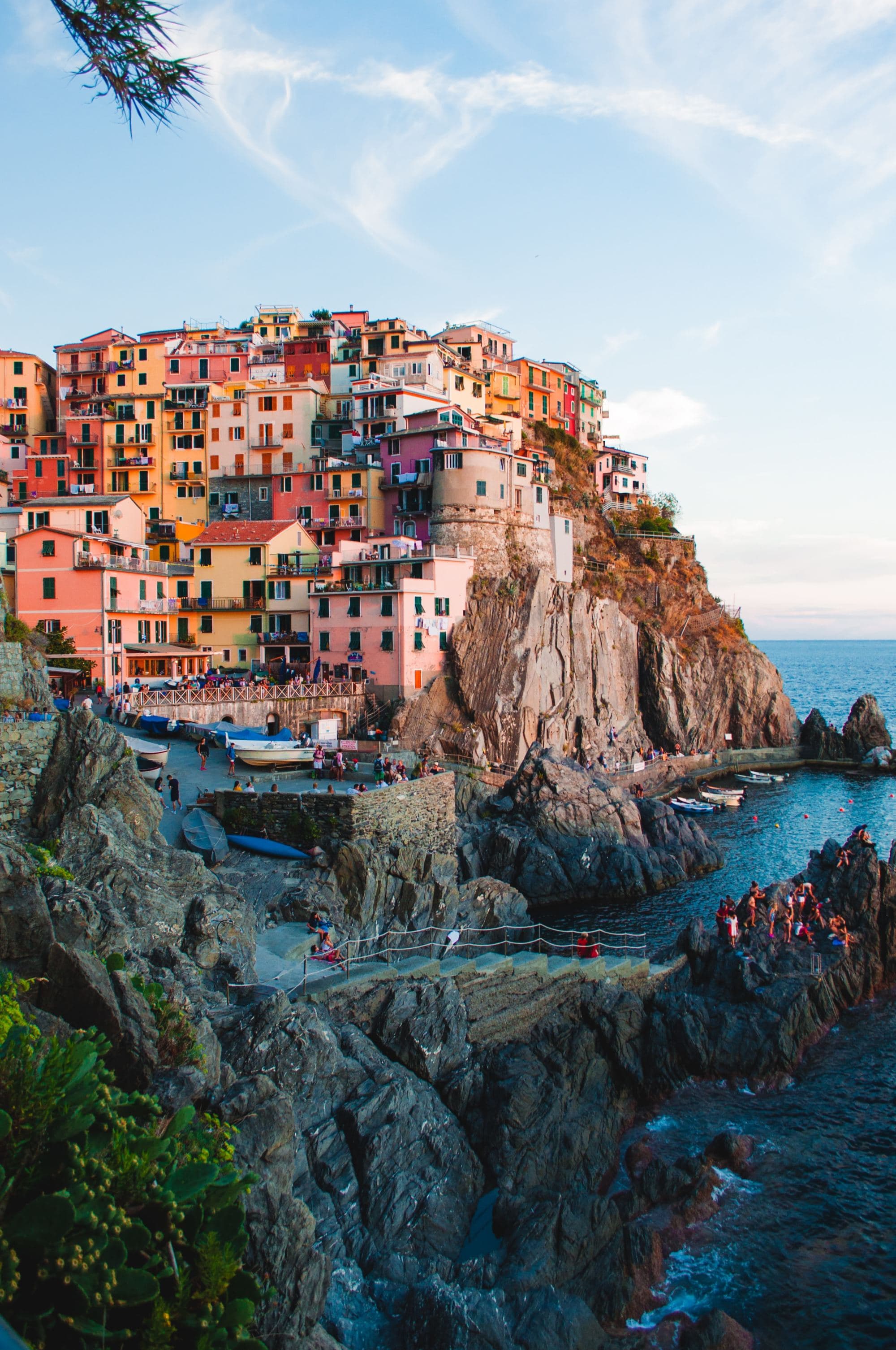 An aerial view of the buildings on the cliff near water during daytime.