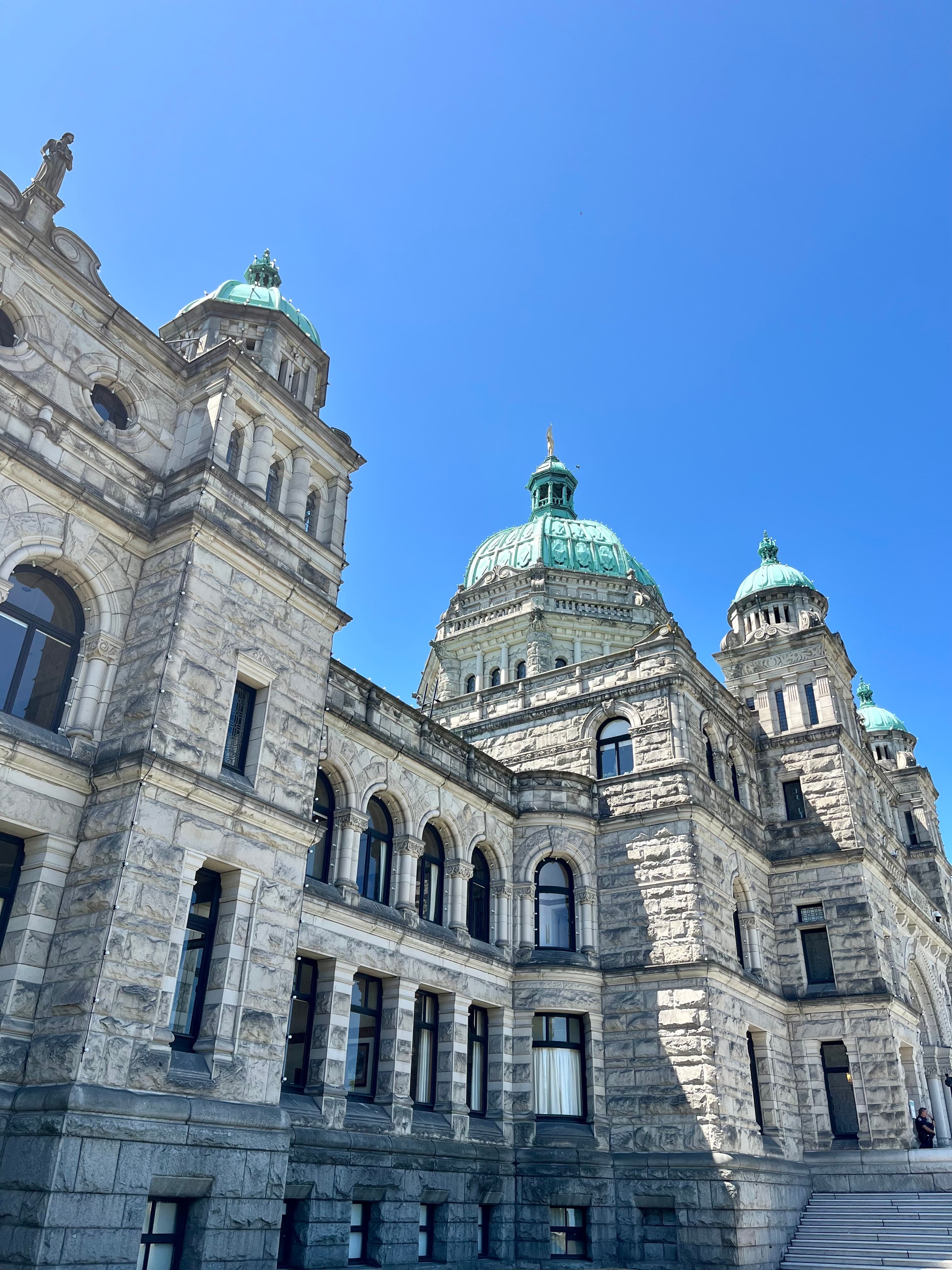The beautiful architecture of the Parliament Building of British Columbia on a sunny day.