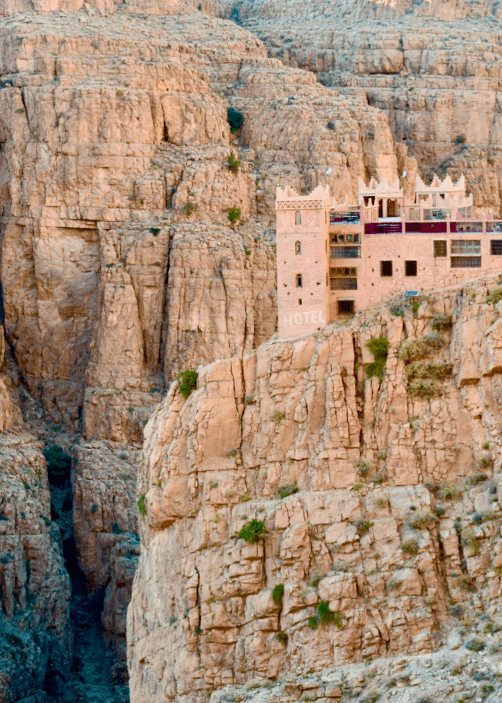 A hotel perched on a beautiful mountain scape.