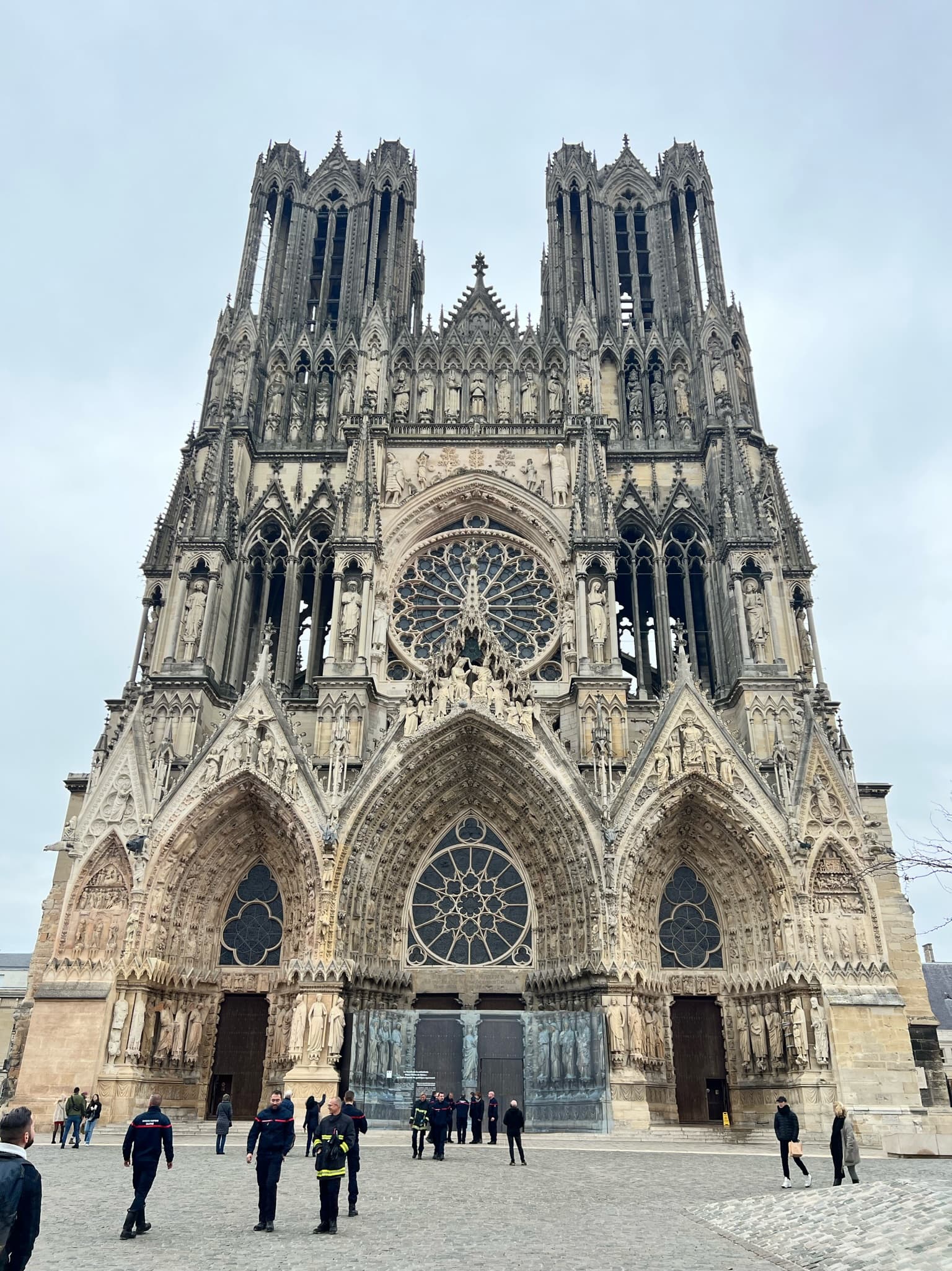 A front view of the majestic Reims Cathedral with its gothic architecture