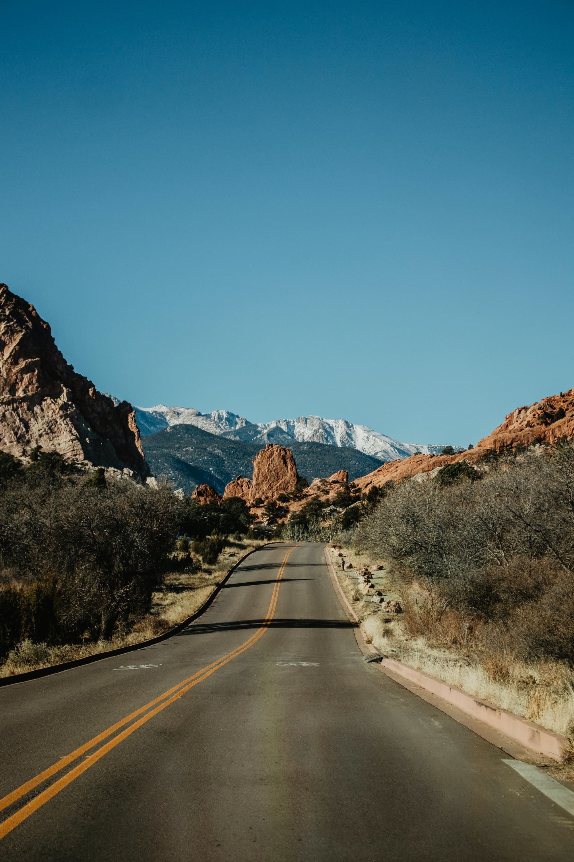 scenic road amid a red-rock mountain range