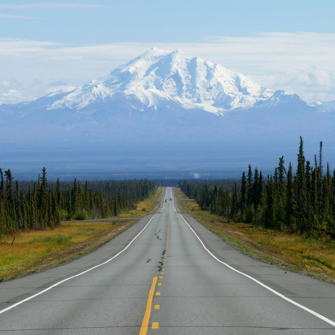 Road towards snow covered mountains
