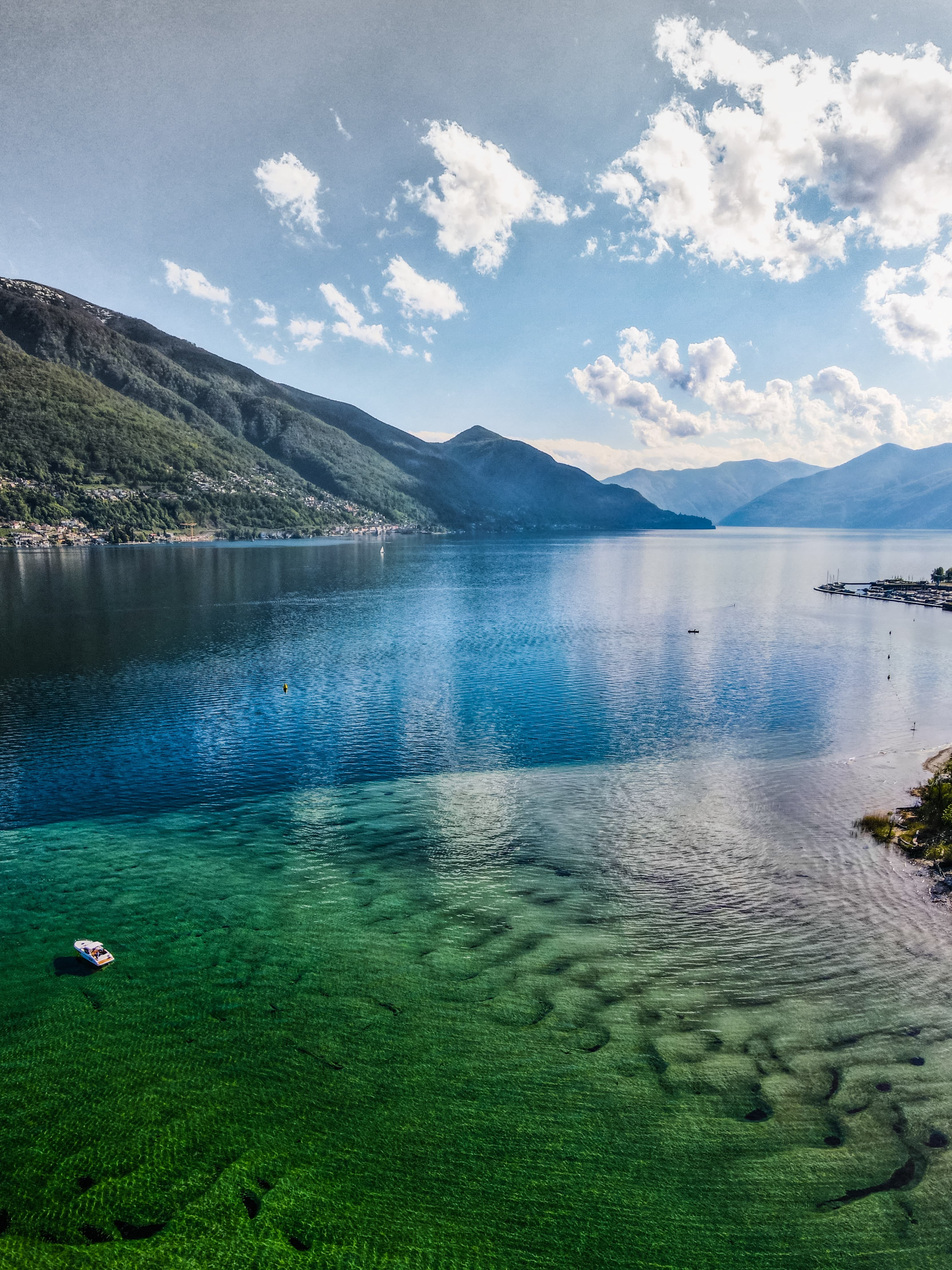 Lake Maggiore surrounded by mountains.
