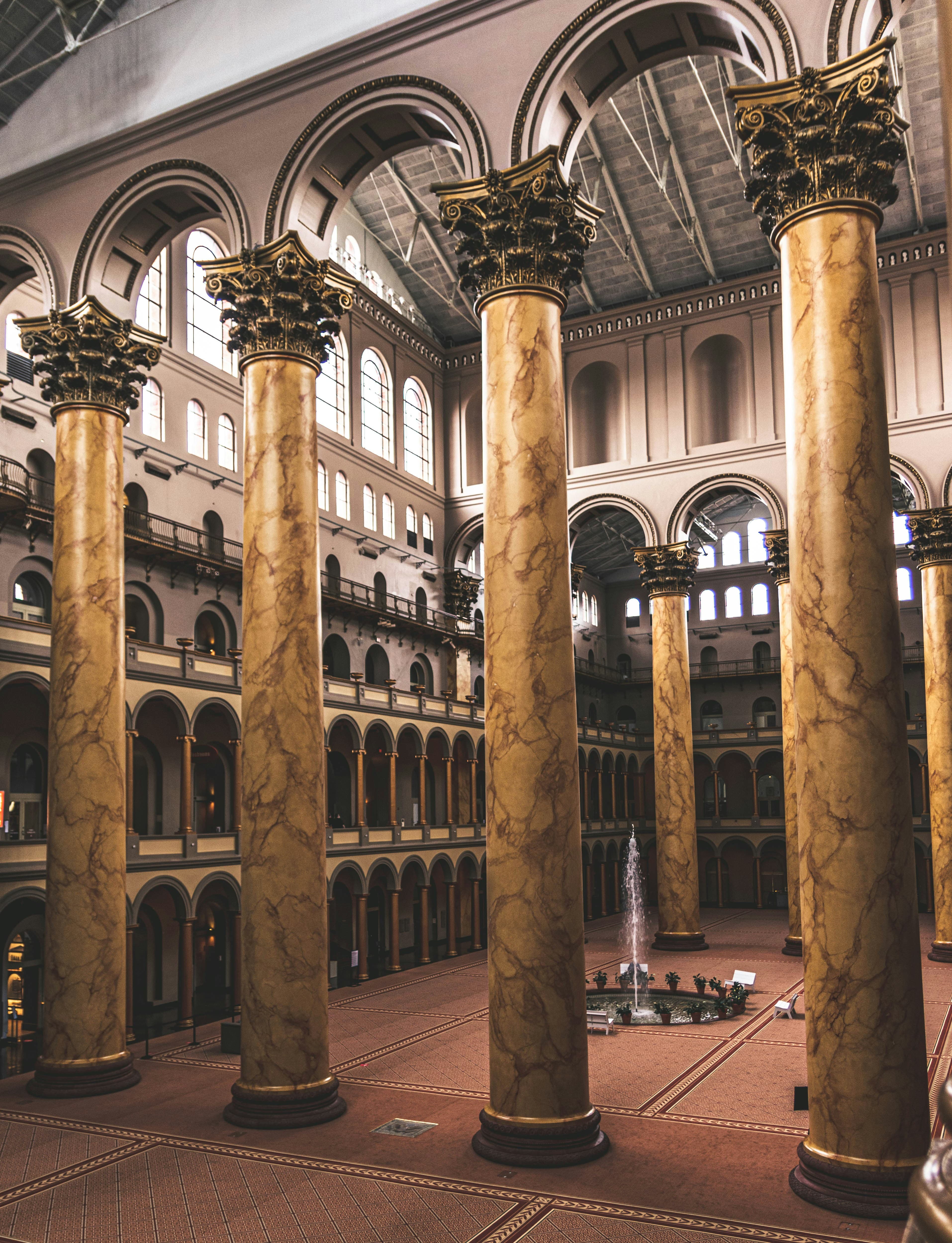 The great hall at the National Building Museum, with large marble columns in the three-story atrium space.