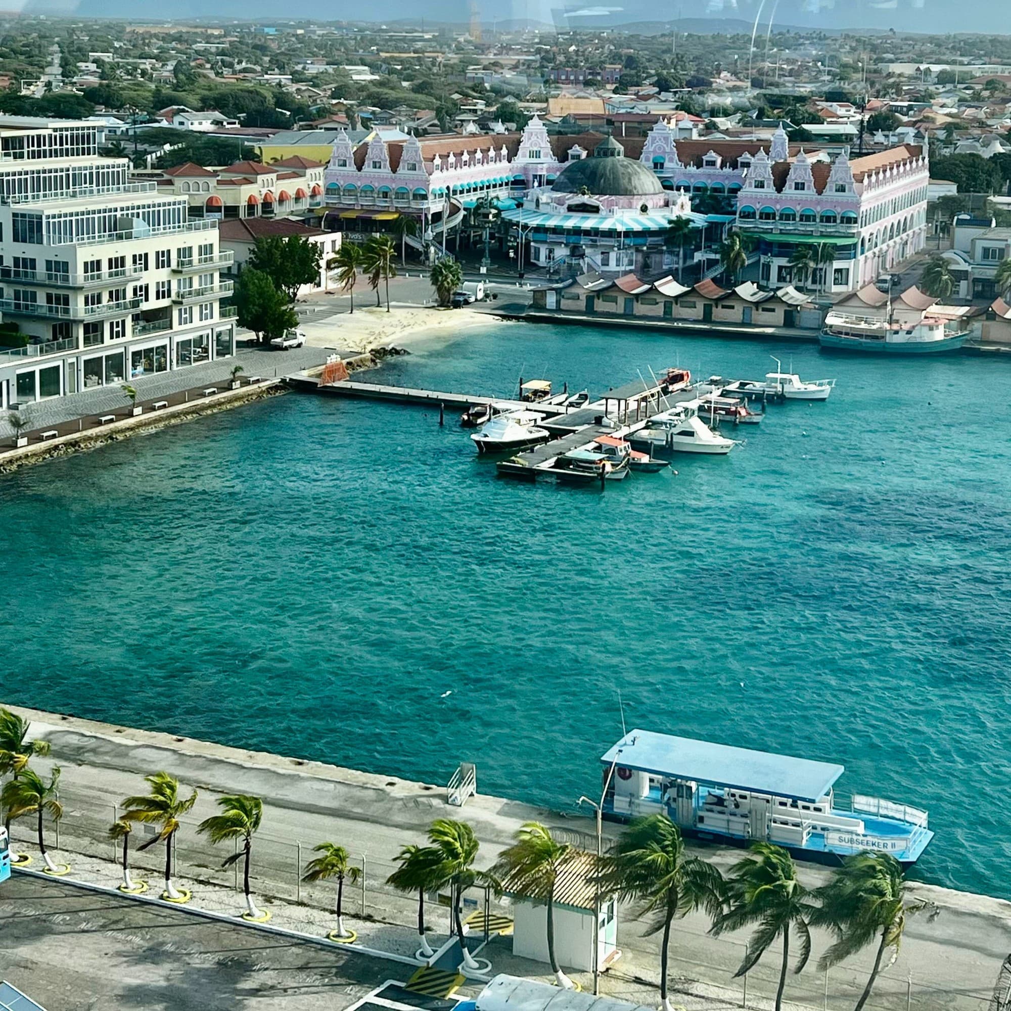 Aerial view of a boat harbor surrounded by waterfront buildings