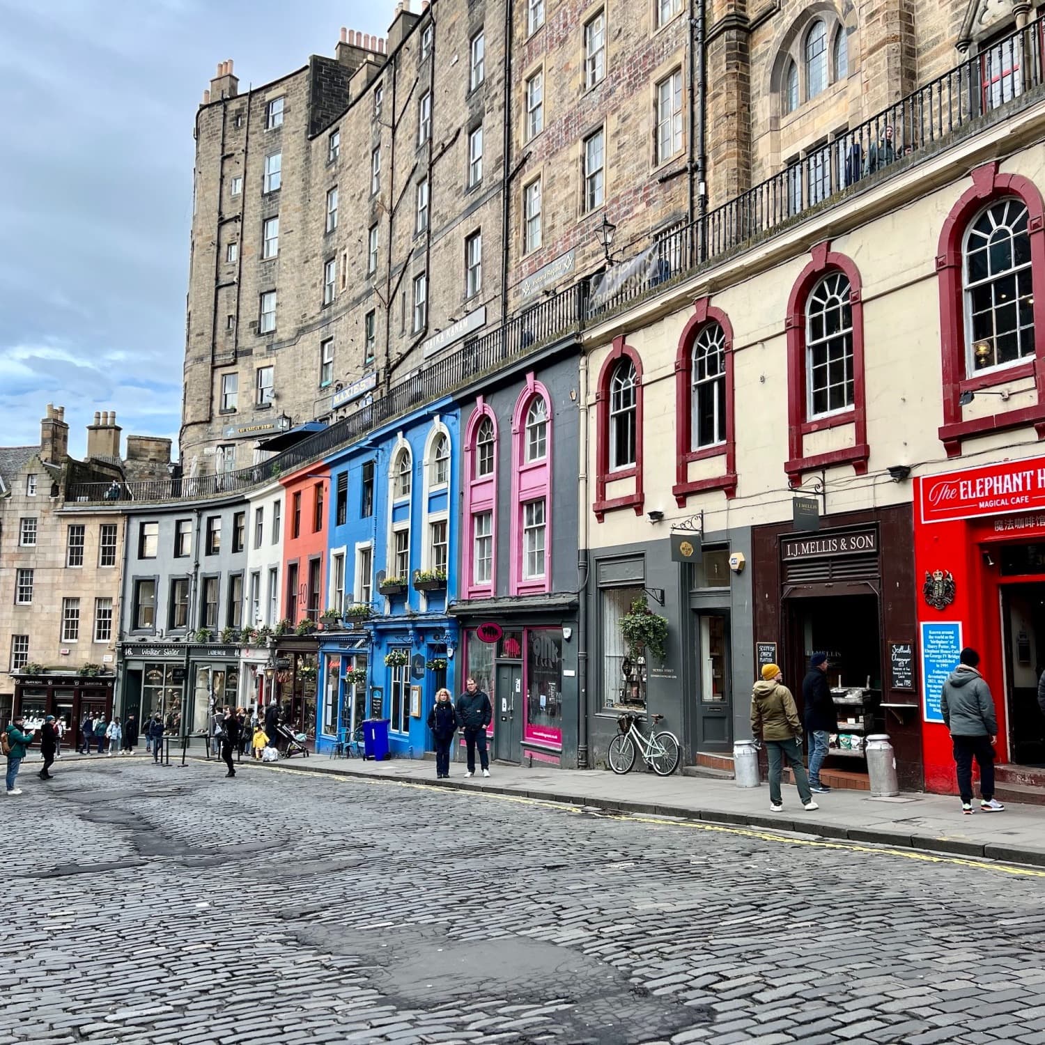 City street with people and colorful buildings.