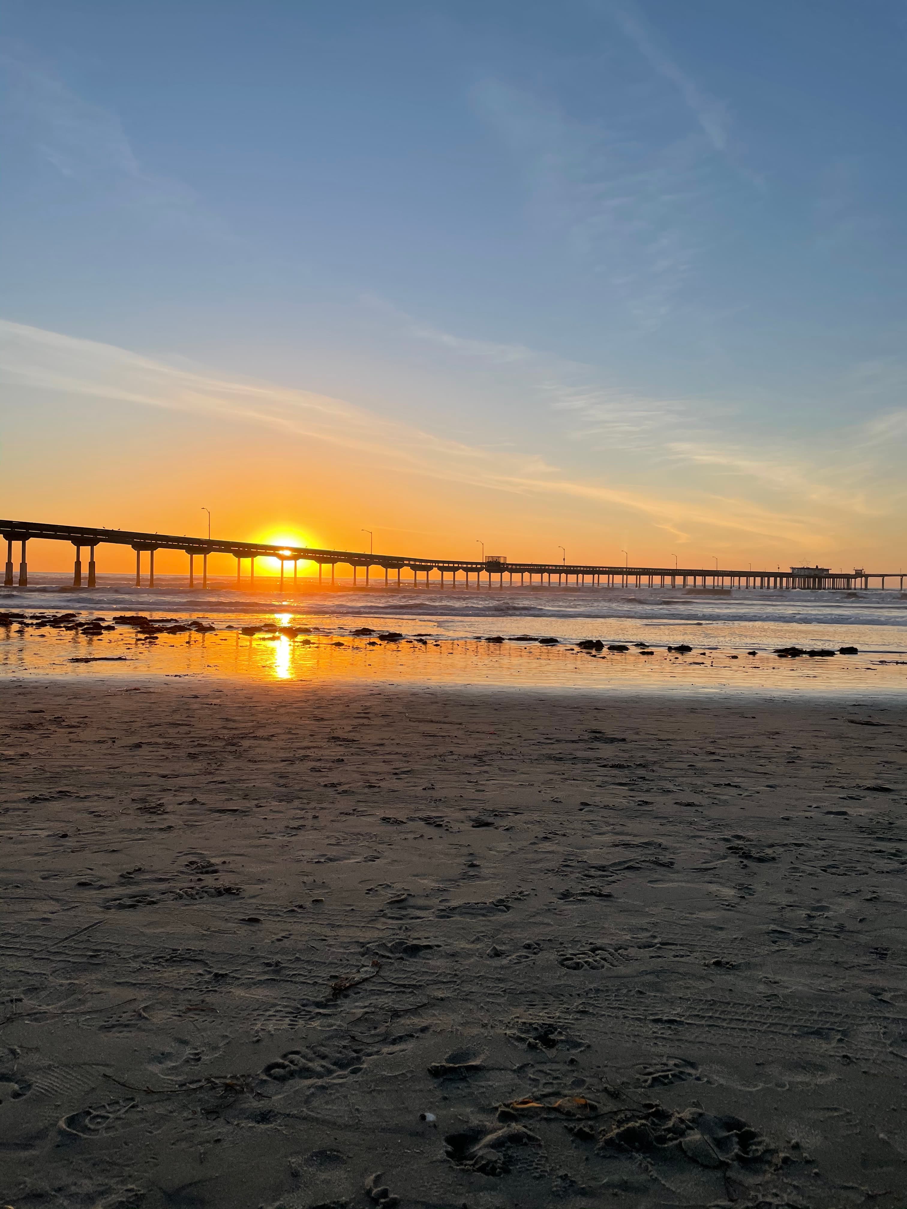A sunset over the water at the beach