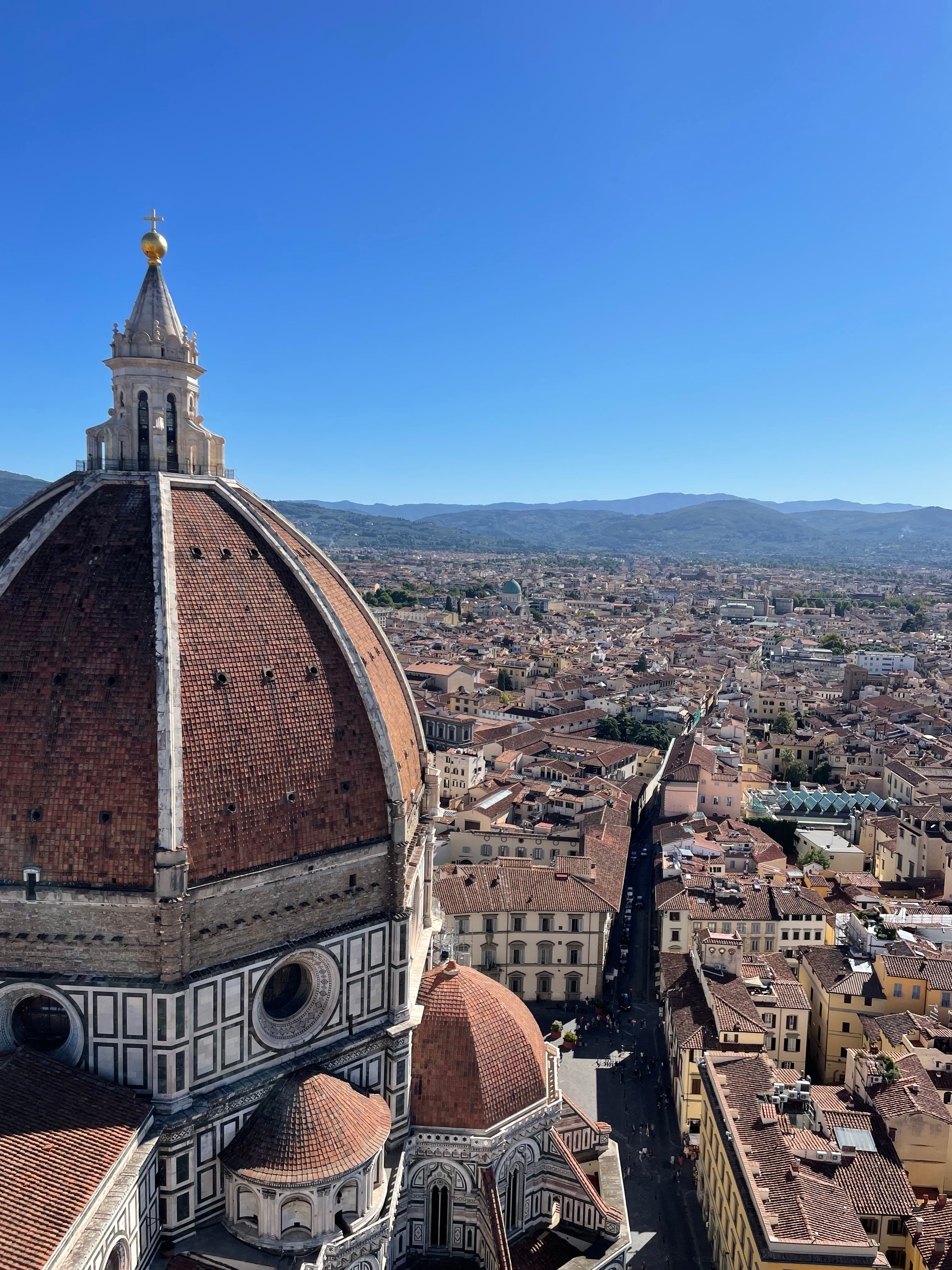 Aerial view of a city from a domed cathedral during the daytime