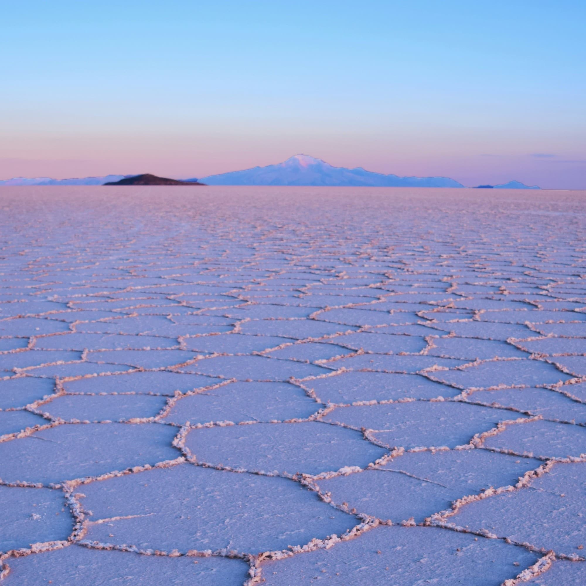A picture of a gray sand surface during the daytime.