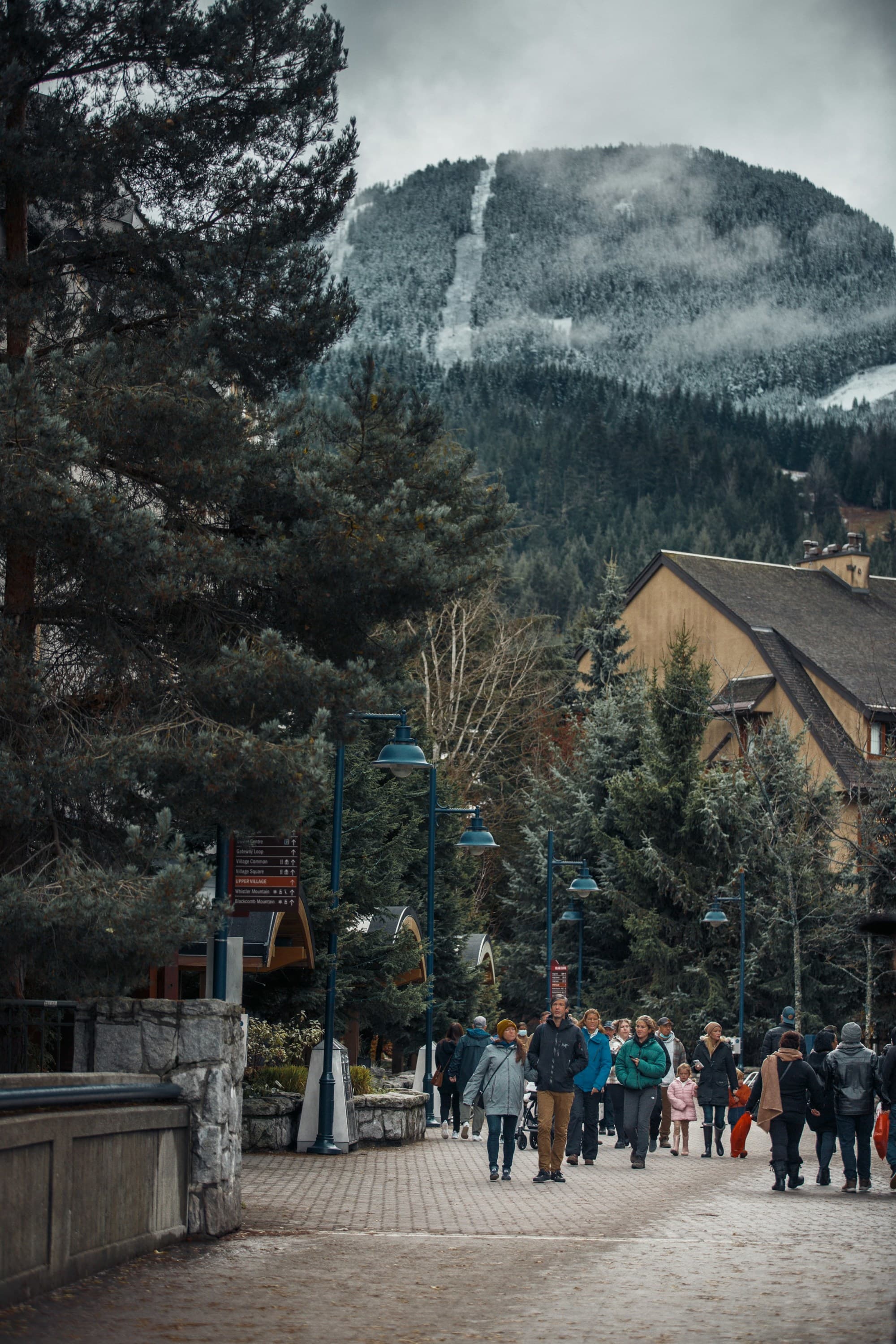 A group of people walking at Whistler Village.