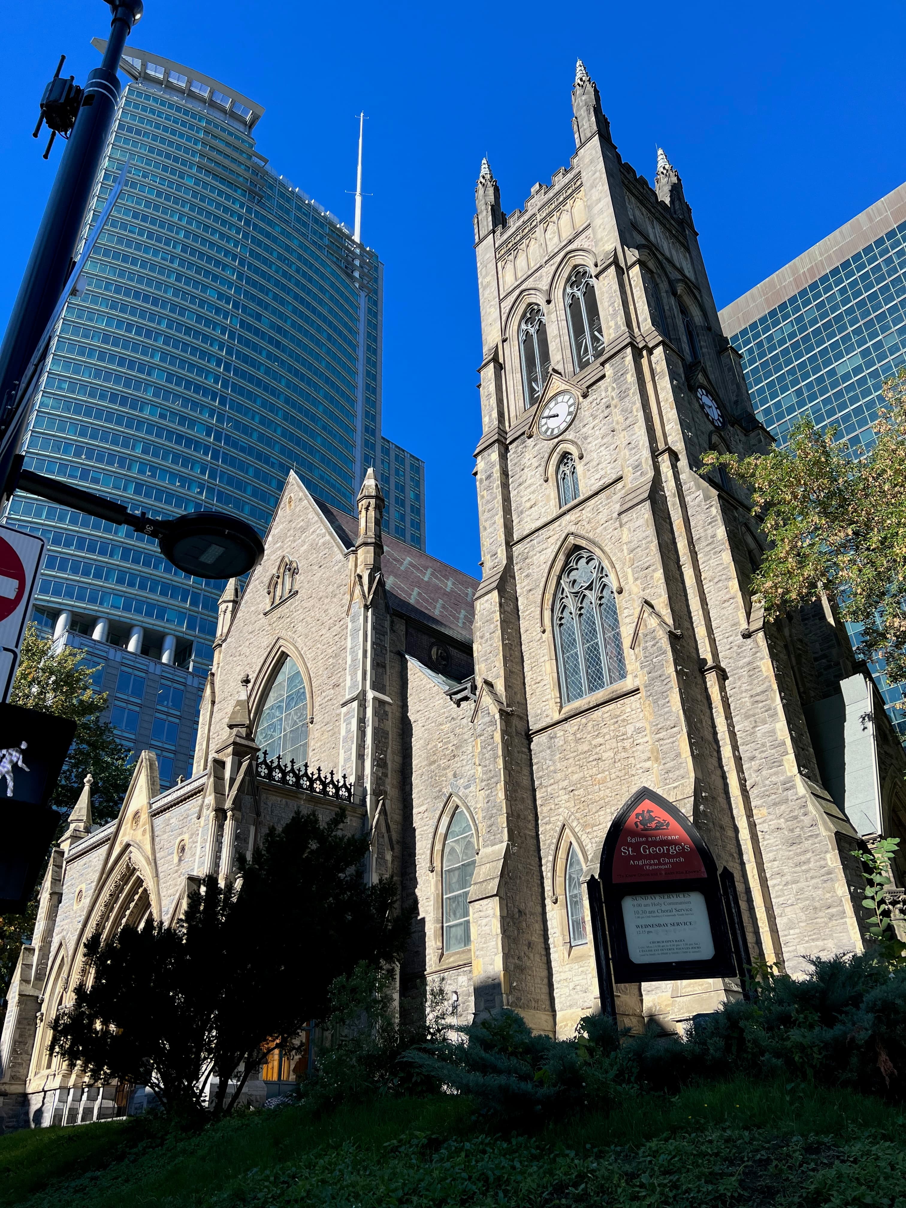 A bottom up view of a church and sky scraper in Montreal.