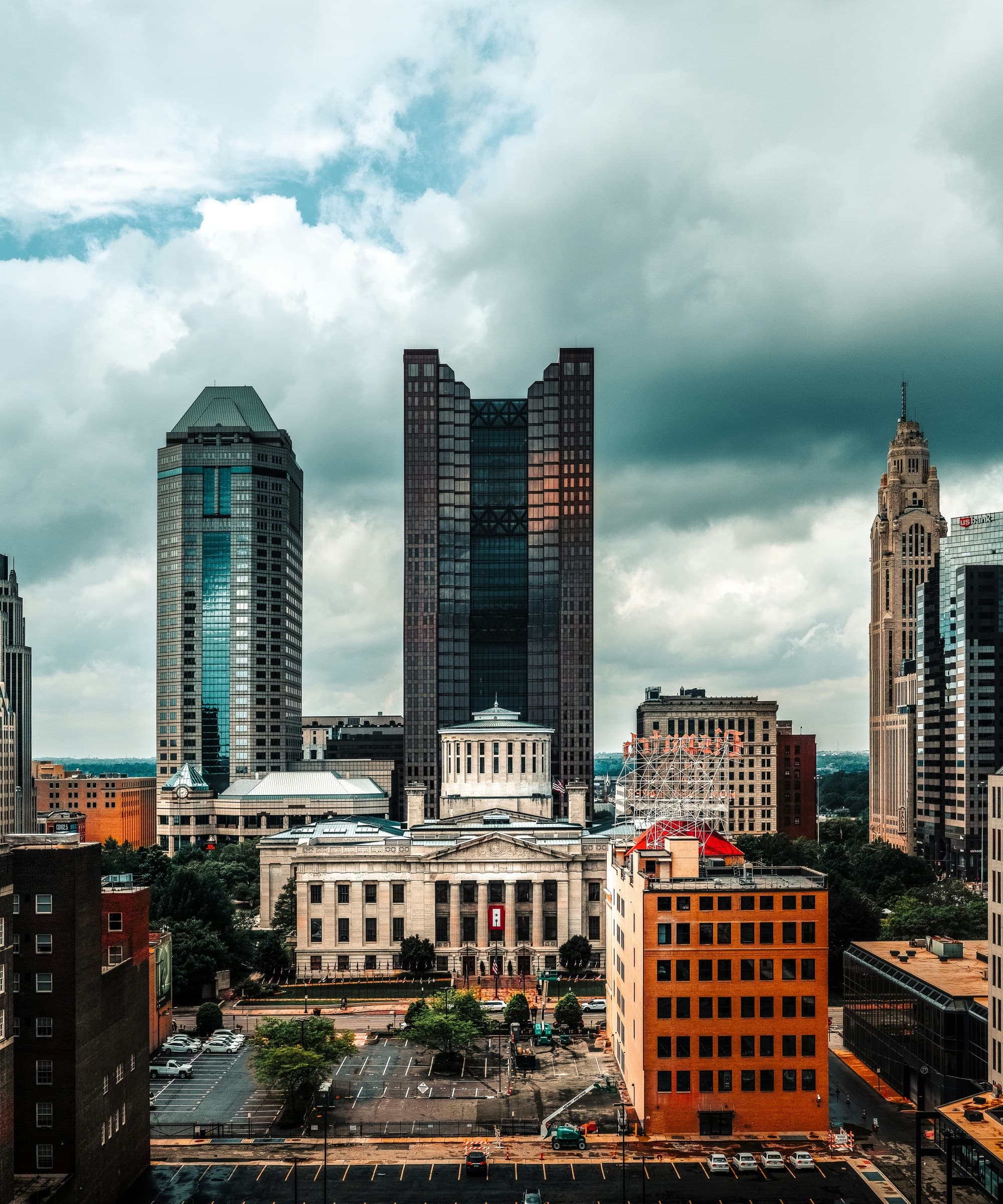 A view of the city skyline with thick clouds above.