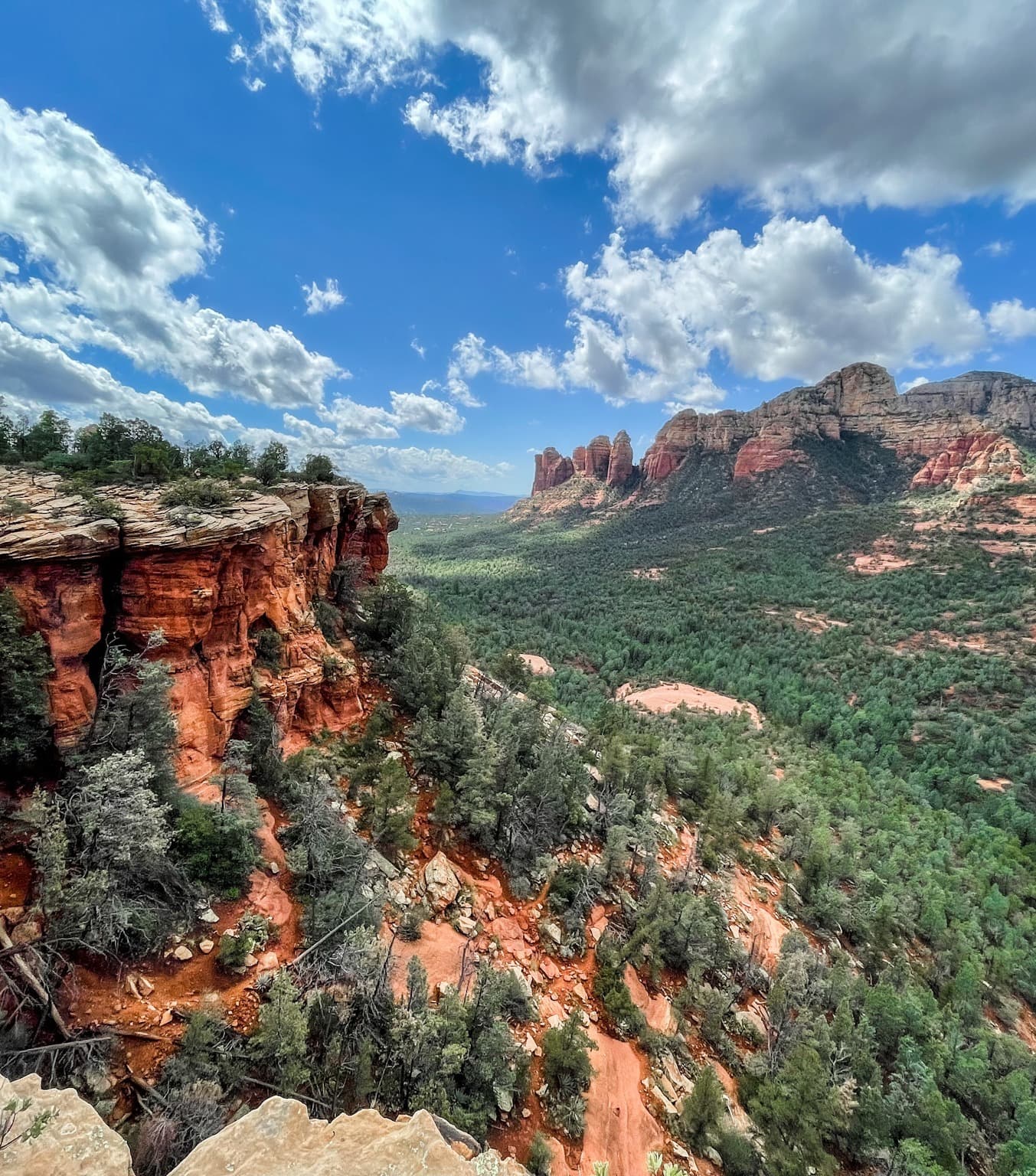 Overlooking at the top of Soldier Pass with miles of greenery and desert mountains.