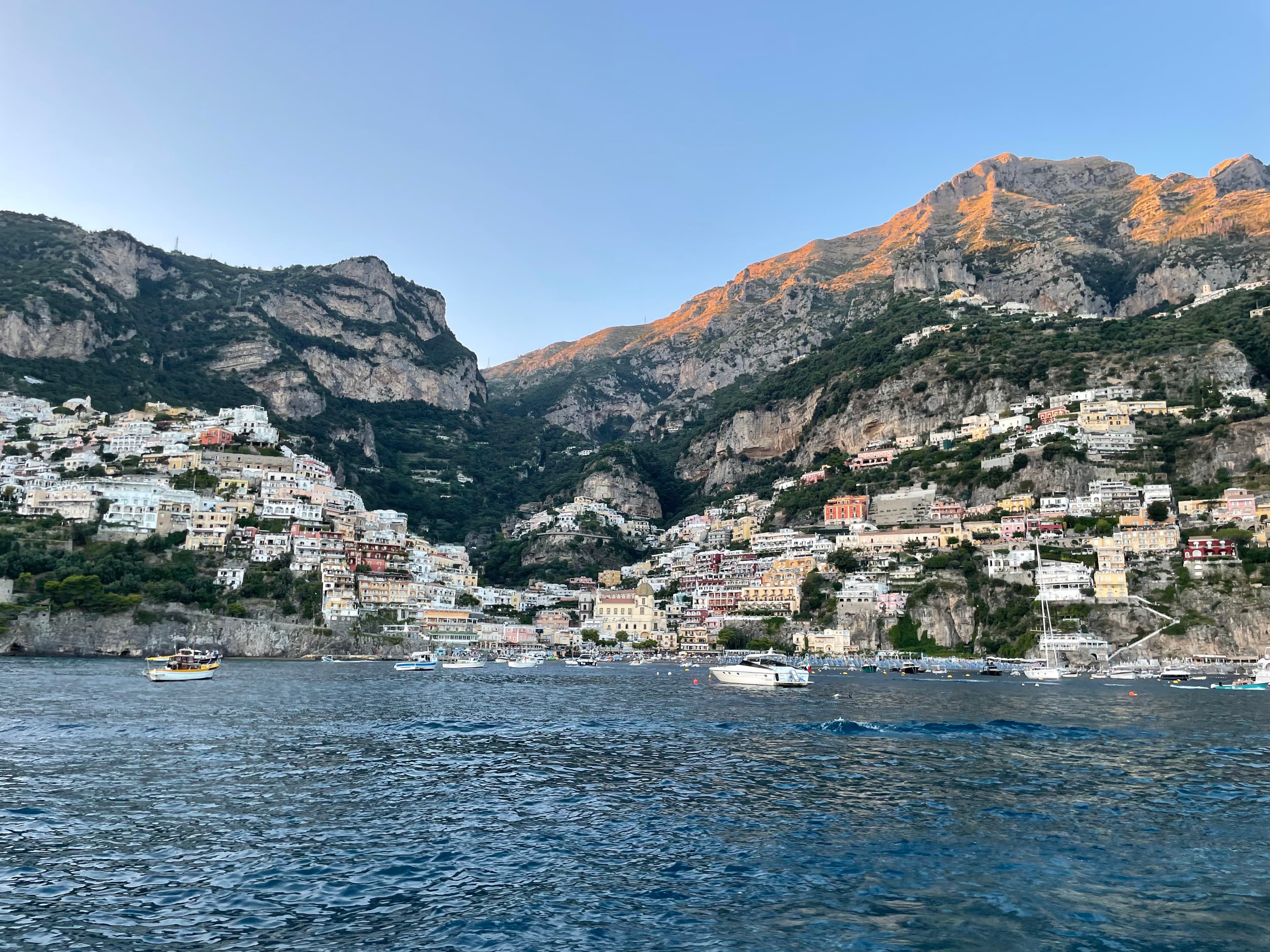 A view from the ocean in Positano facing the iconic town that is built on the mountainside.