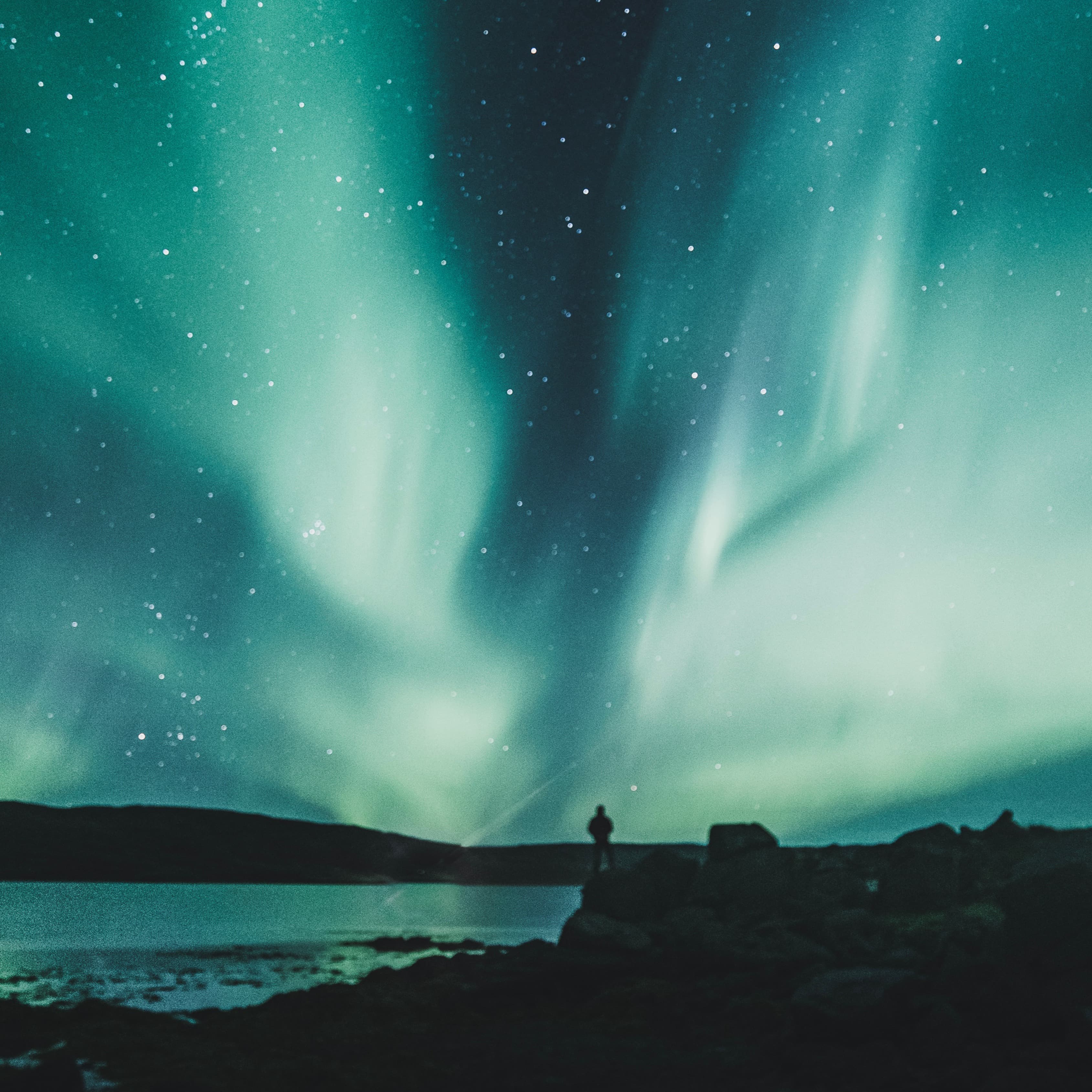 An aesthetic photo of nature at night having water body in it