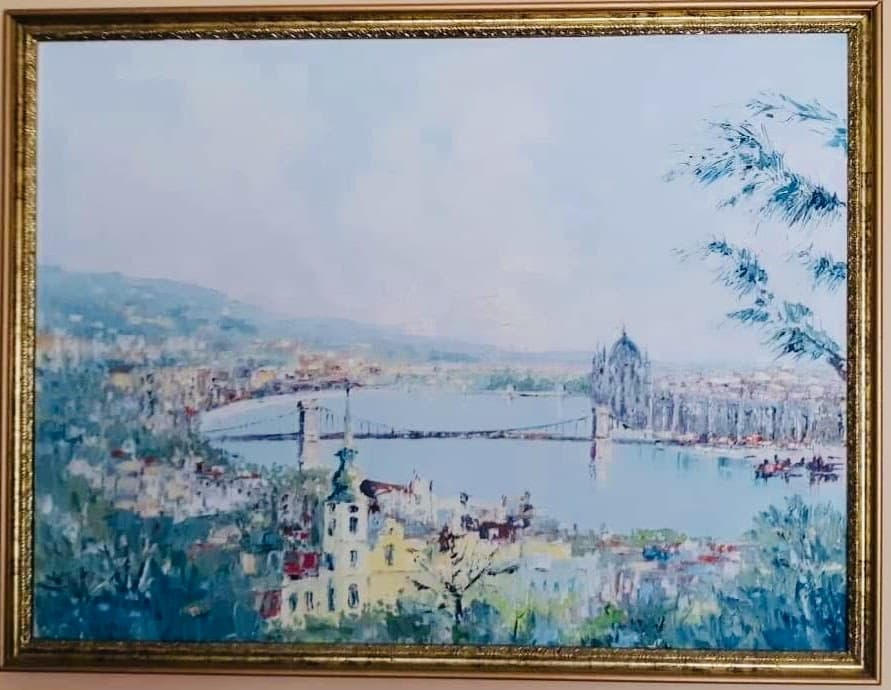 A silver statue wearing a cape.