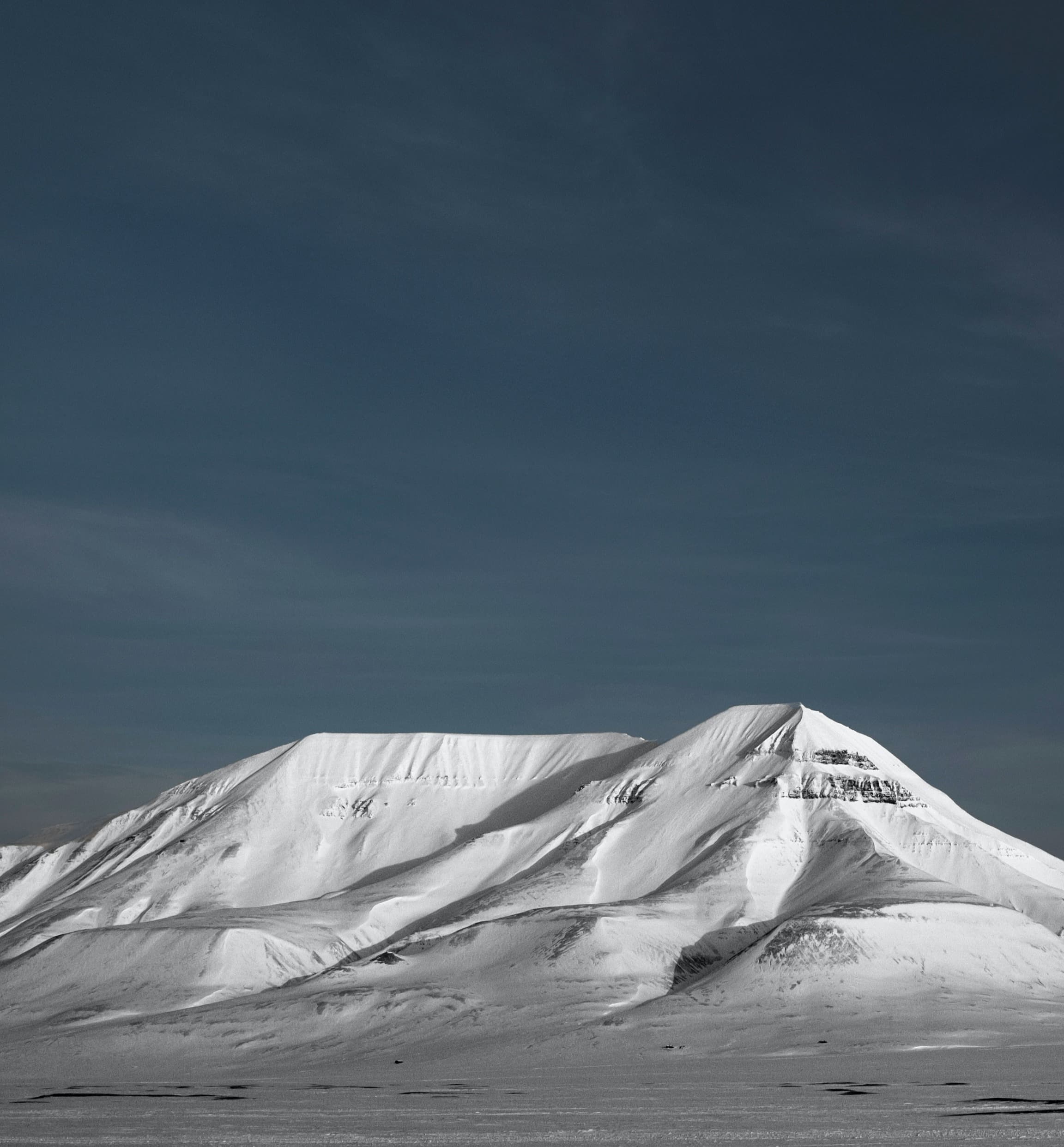 Snowy-capped mountain during nighttime