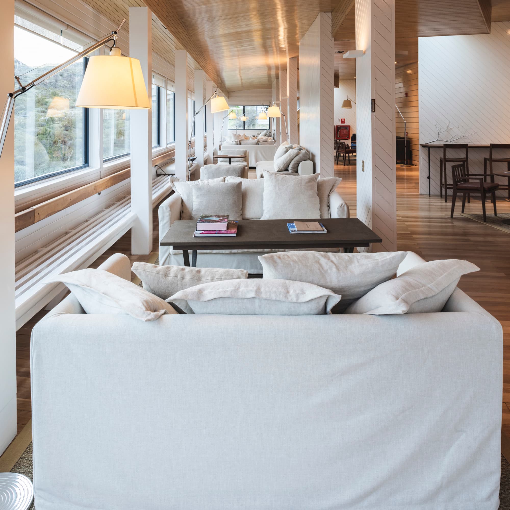 large living room with beams and white couches