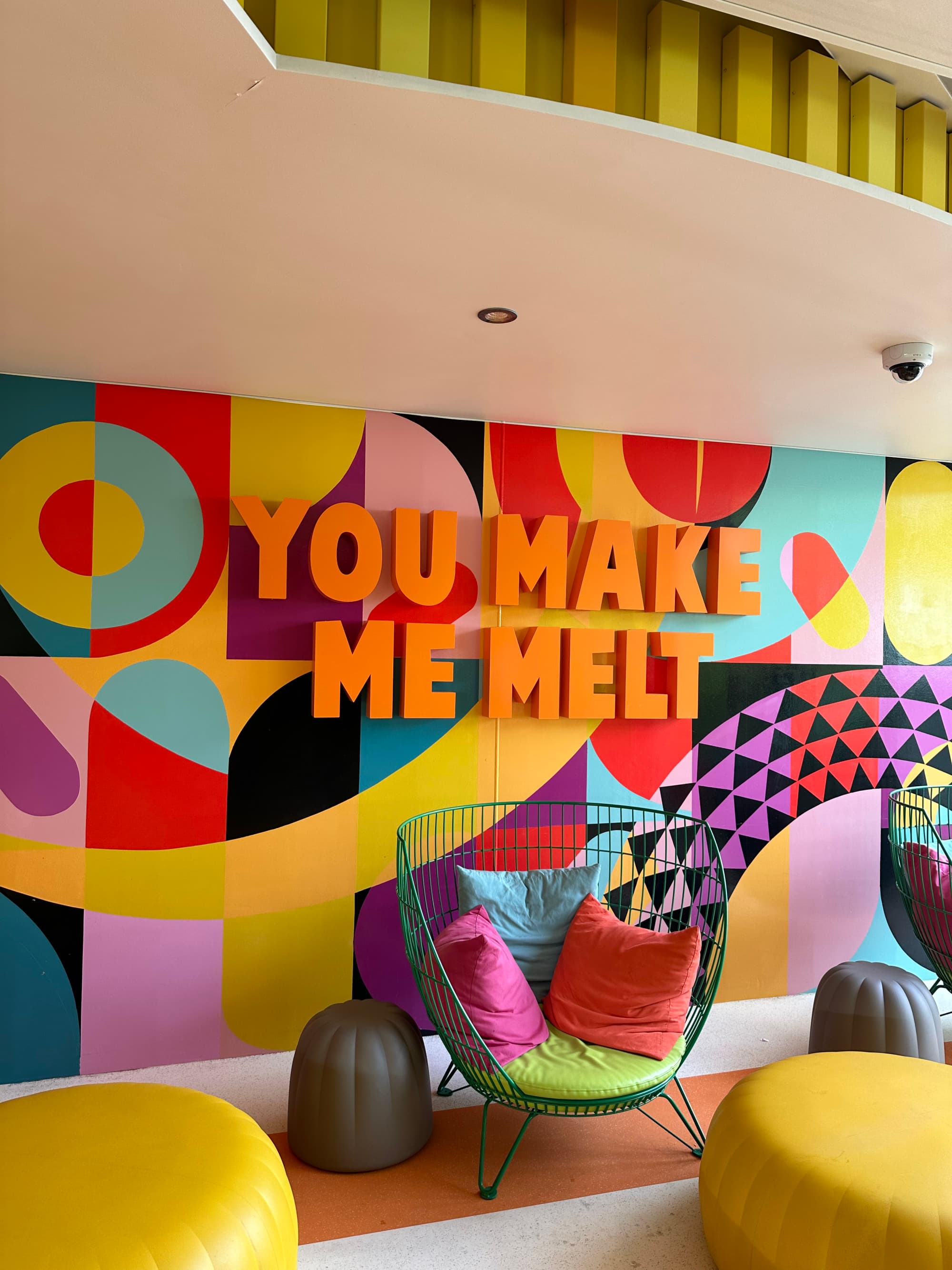 Sprinkles ice cream bar with bright, lounge-type seating aboard the ship.