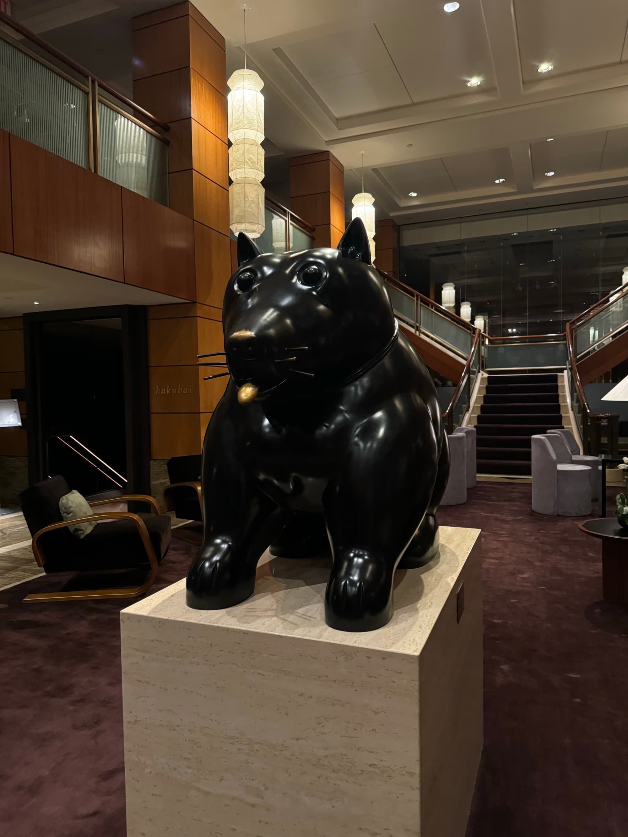 A statue in the hotel lobby that matches the mysterious setting of the hotel.