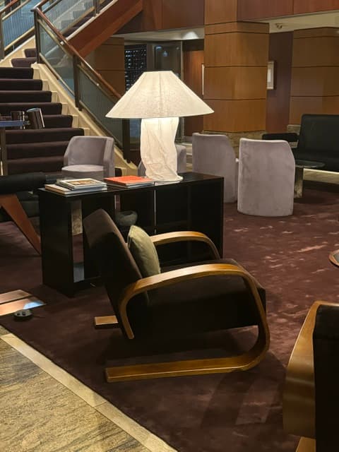 A sitting area in the hotel lobby with chic interior.