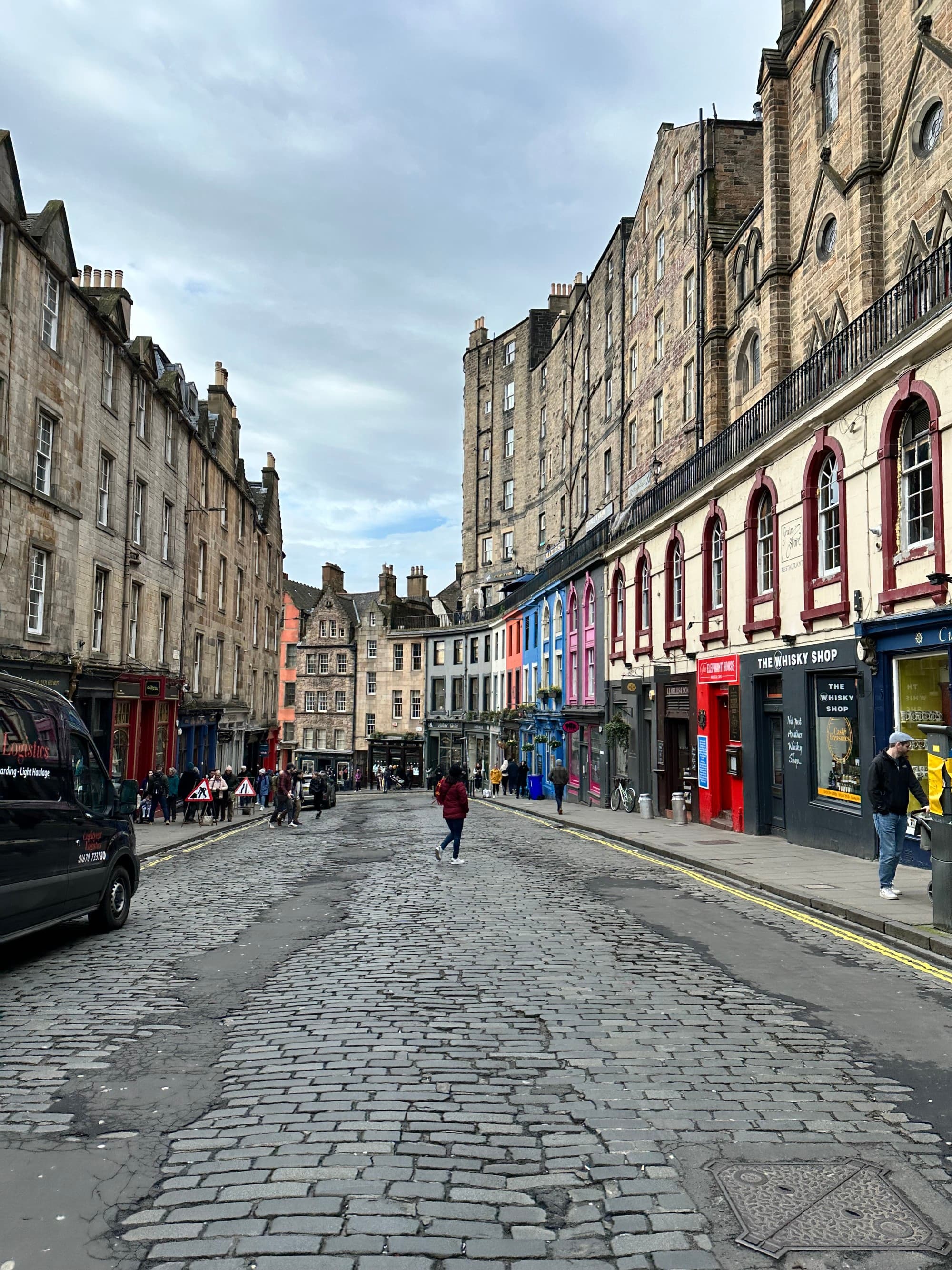 Cobblestone street with row houses.