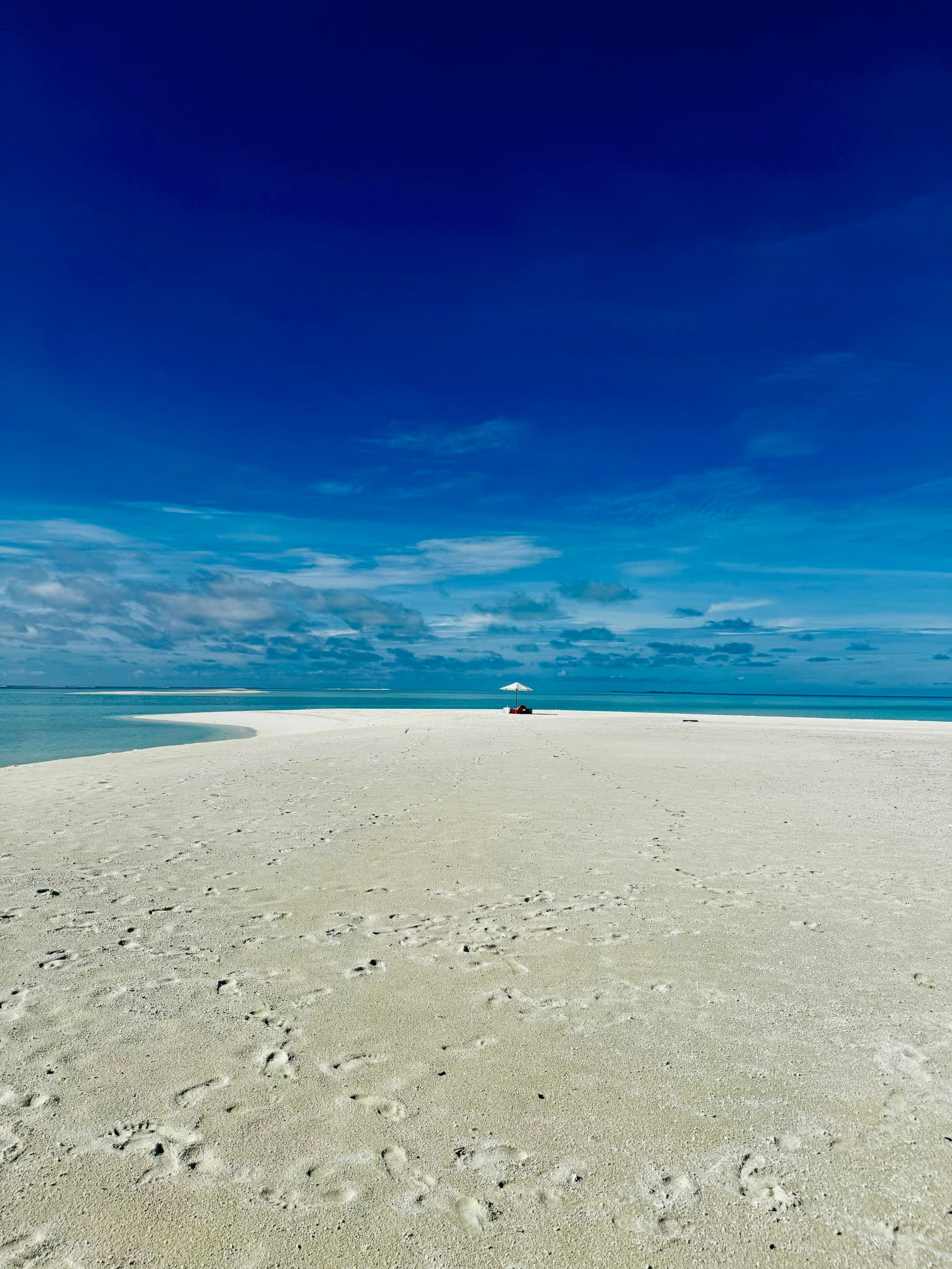 White sand with deep blue sky.
