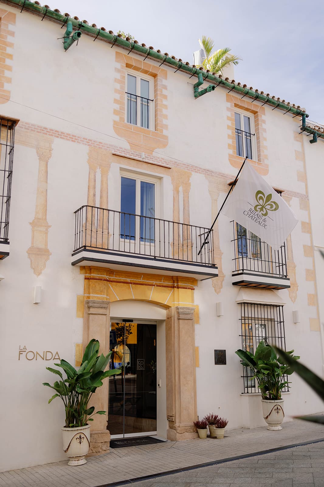 a white Spanish building on a sunny day