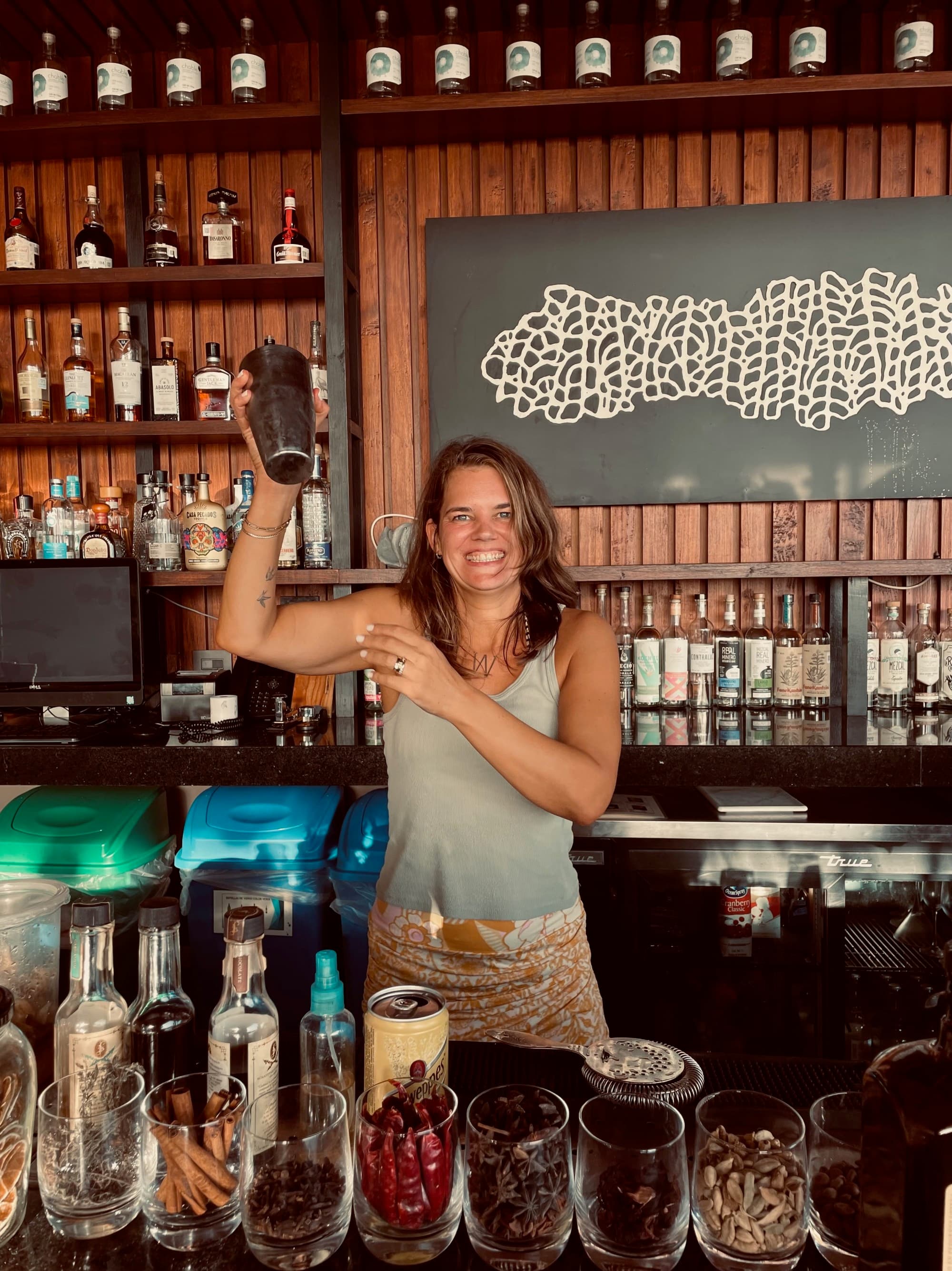 Bartender shakes drinks.