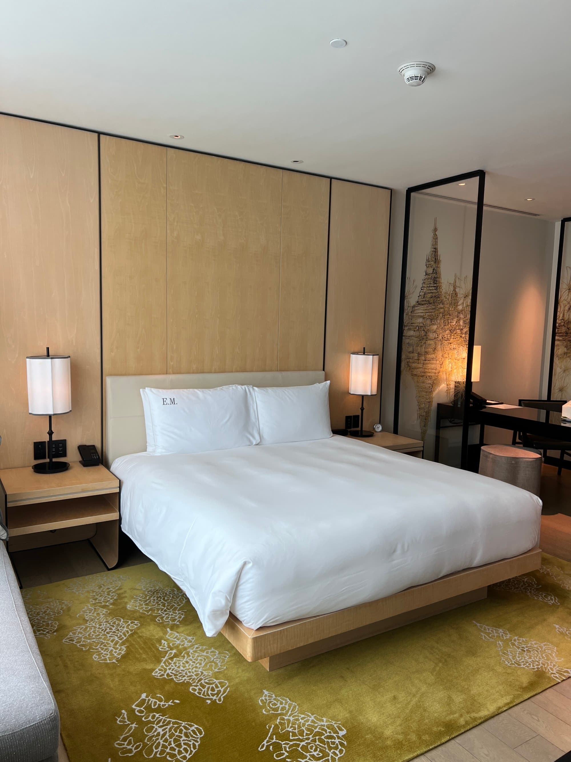 Park Hyatt Deluxe King room with tan walls and white bedding - Emily Martin