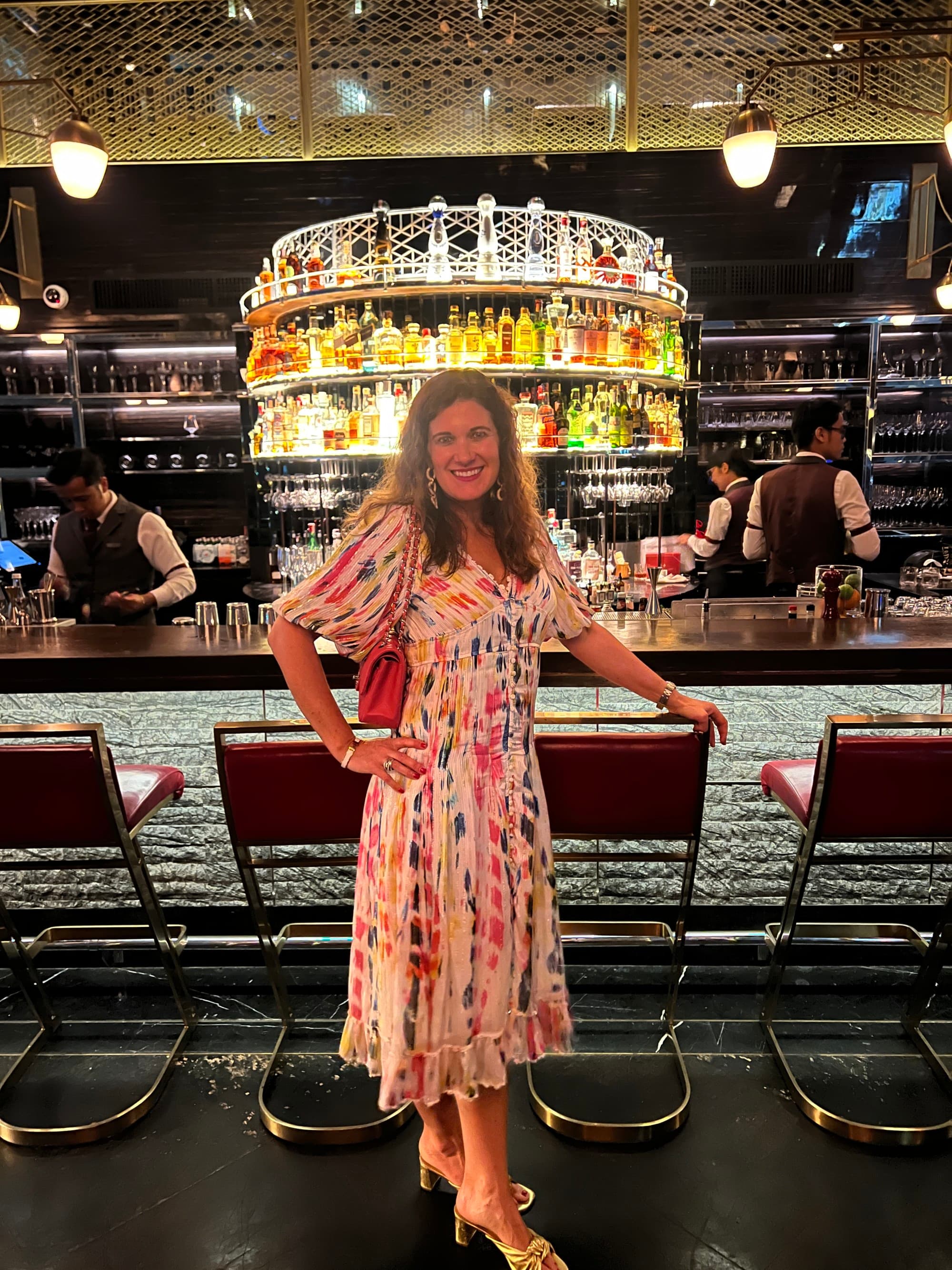 Advisor posing in front of the Penthouse Bar & Grill - Emily Martin
