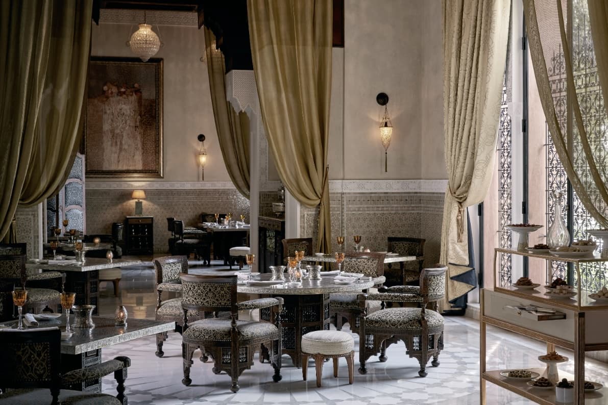 dining room with grand golden draperies and Moroccan decor