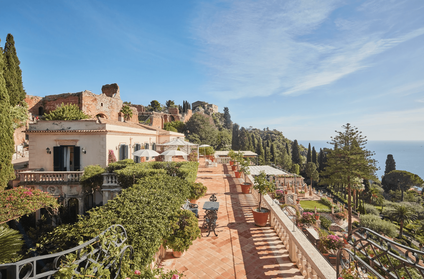lush gardens surround a luxe Mediterranean estate