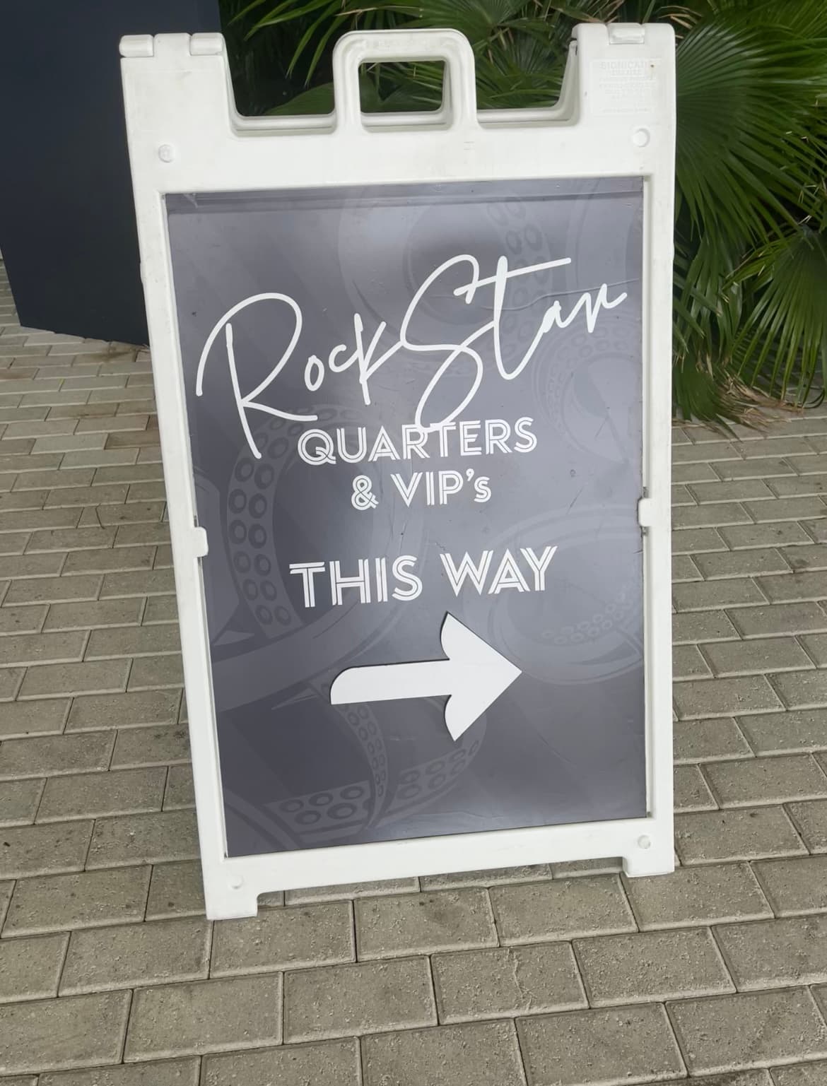 A sign reading "Rock Star Quarters & VIP's this way" with an arrow pointing to the right