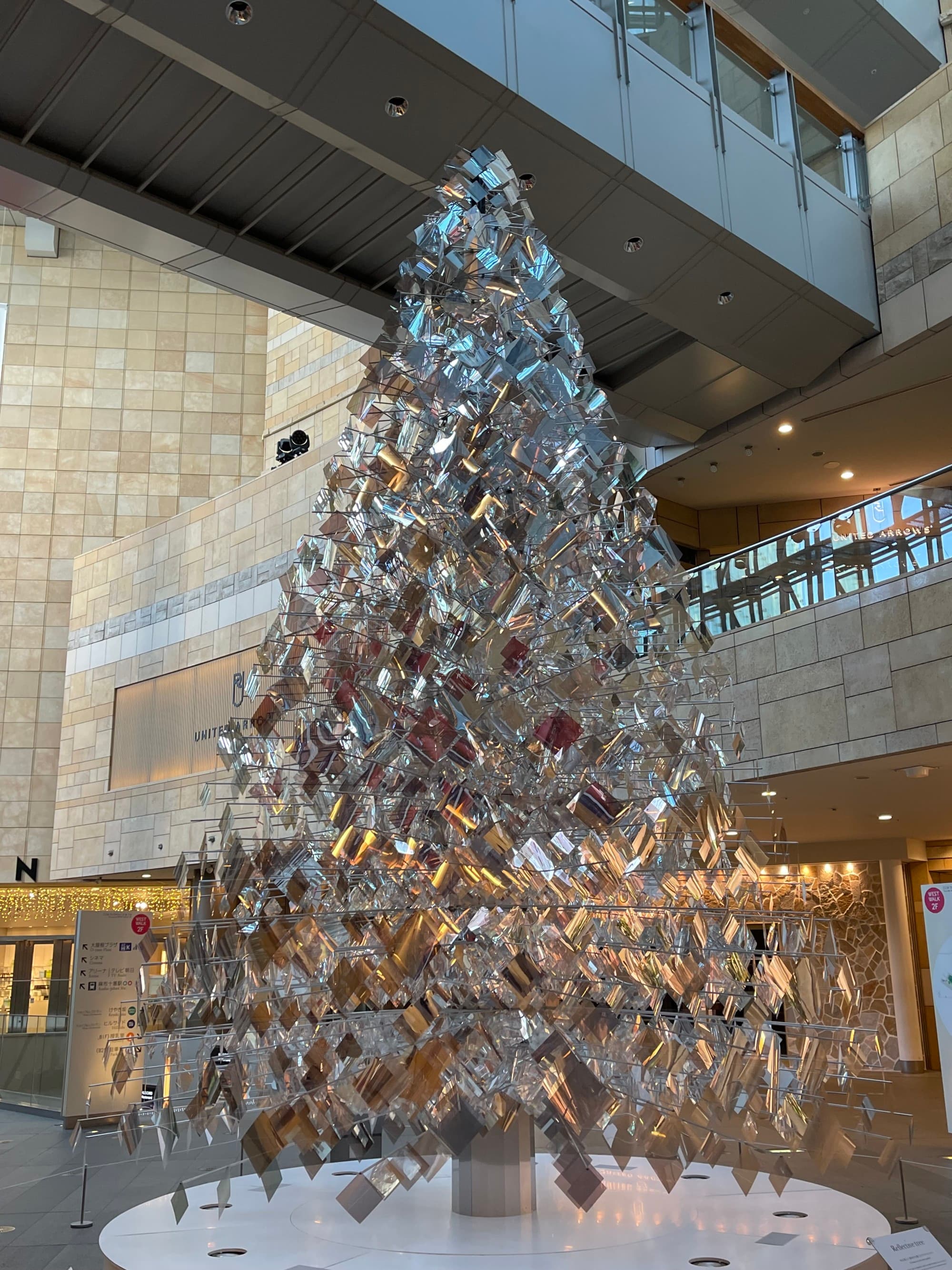 an indoor Christmas tree made out of ornaments