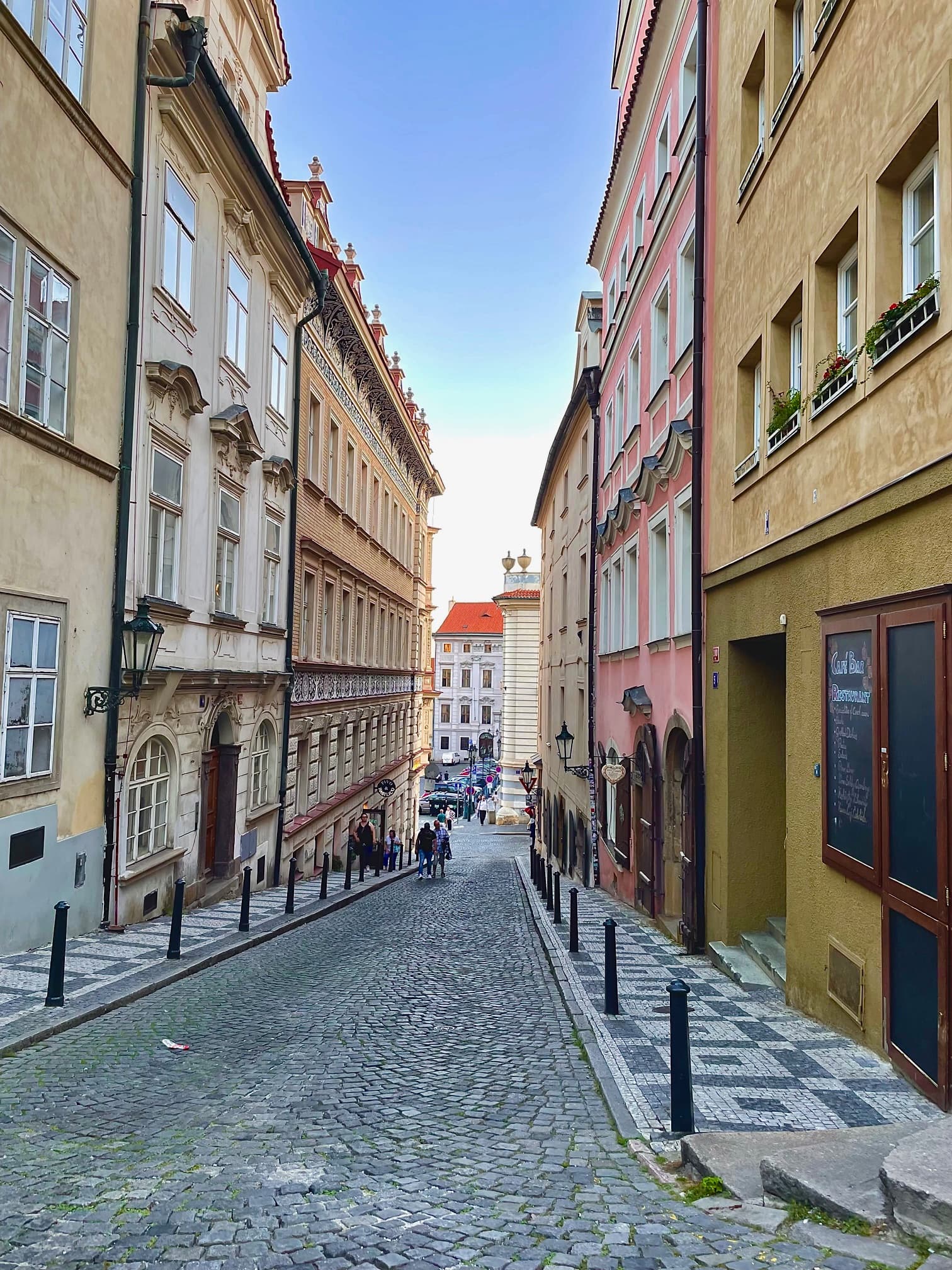 Cobblestone Street with colorful buildings in Prague - Lauren Baroevich