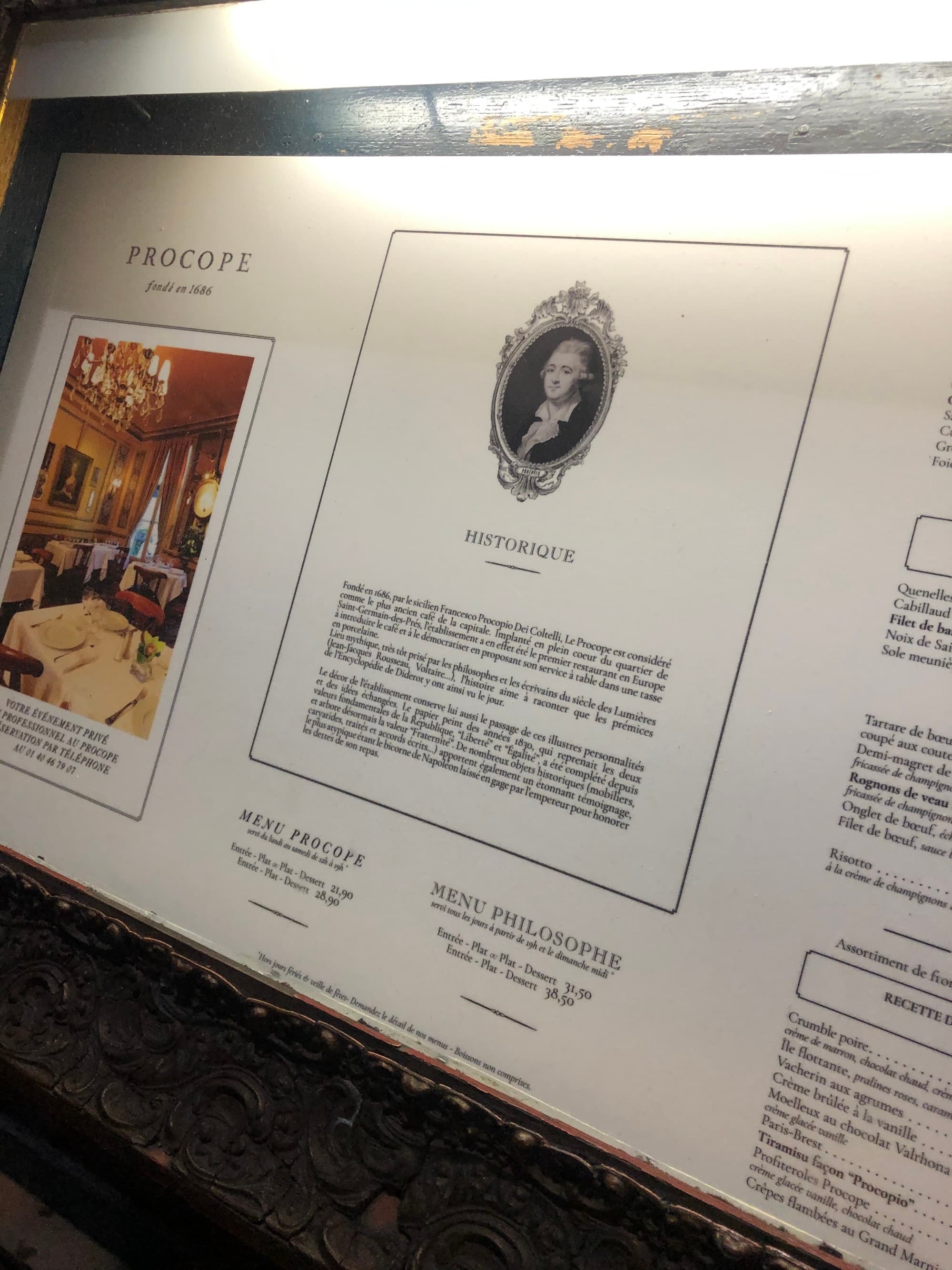 A sign at Procope Restaurant about the history of the restaurant